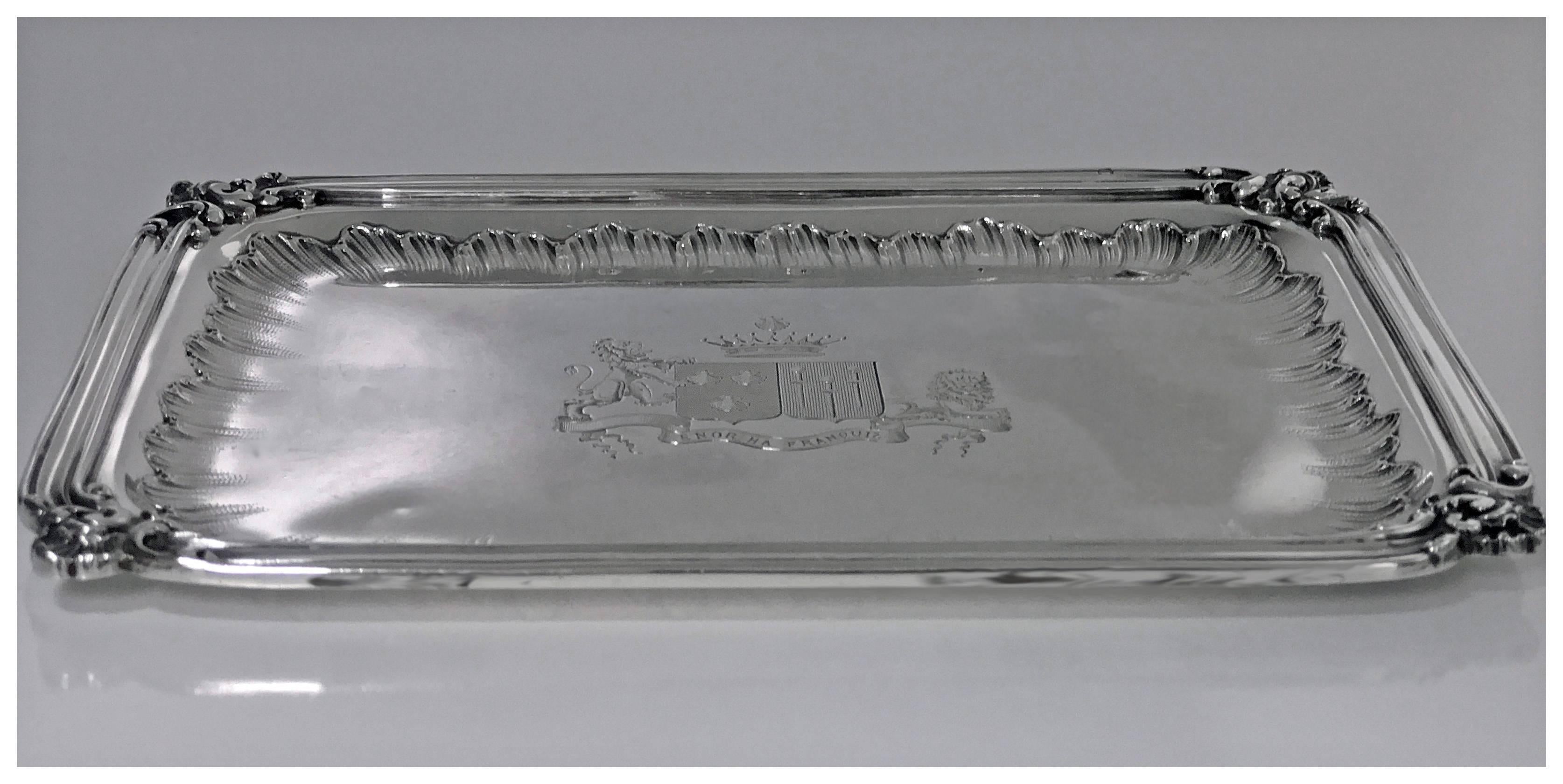 French 1st std (.950) silver tray, circa 1900, Frays Fils. The tray of small rectangular shape, raised ribbed border accented shell cornices, the interior plain with stippled surround crested in the centre with elaborate coat of arms surmounted with