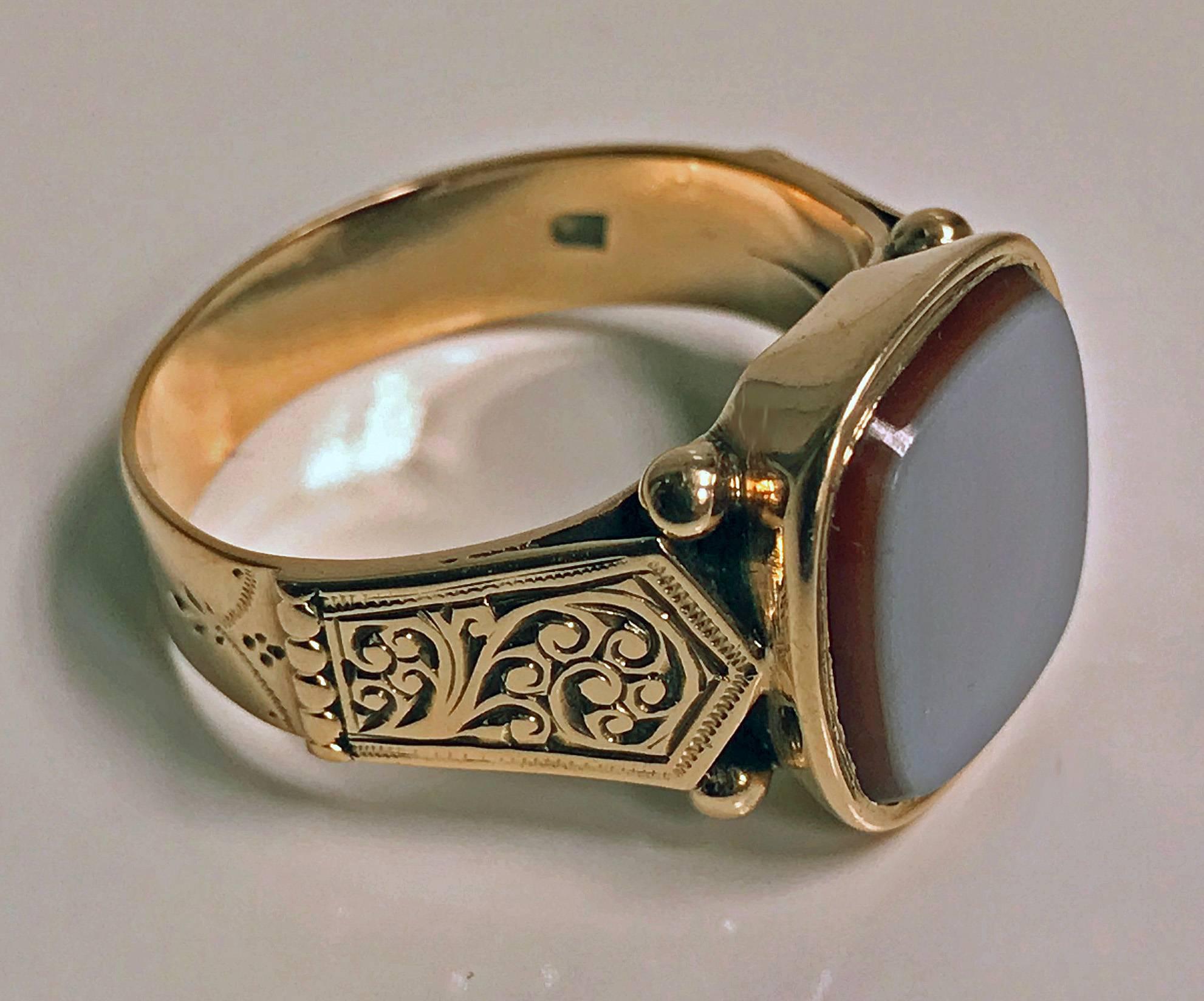 Antique gold gents signet ring, Sardonyx, Austria, circa 1890. Nice large size, unengaged sardonyx, approximately 14 mm cushion, finely carved shoulders, plain shank base. Stamped with Austrian marks for 14-Karat, Vienna. Ring size: 10. May be