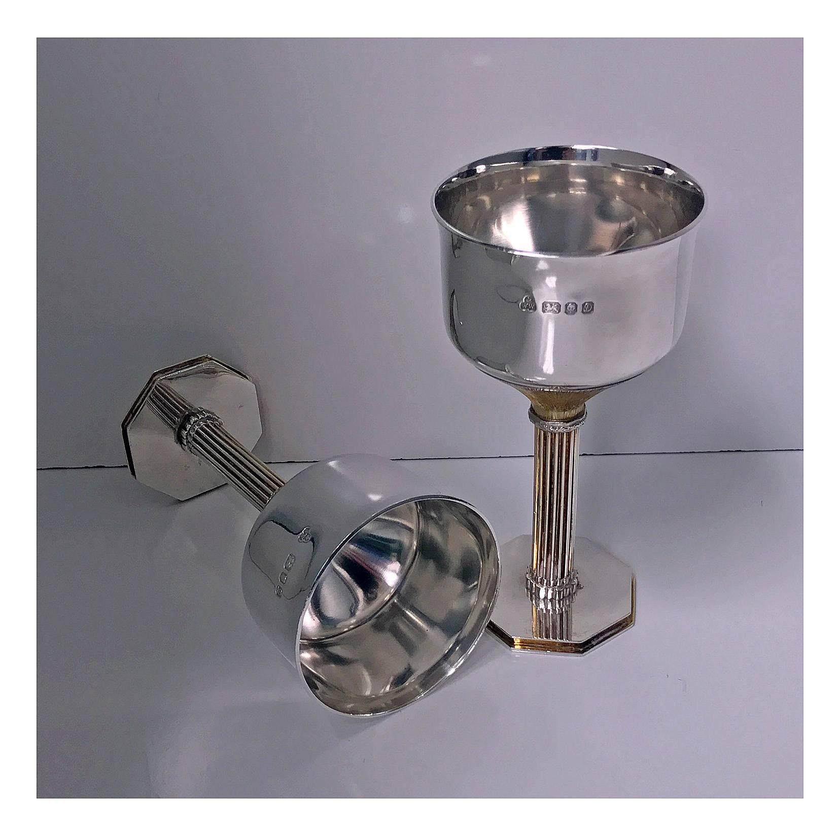 Pair of sterling silver and gilded goblets, gilded column style stems and octagonal bases, the cups of plain wasted form. London 1978, Wakely and Wheeler. Measure: Height 13.5 cm (5.25 inches), weight approximate 366.05 grams. (11.76 oz). Fully