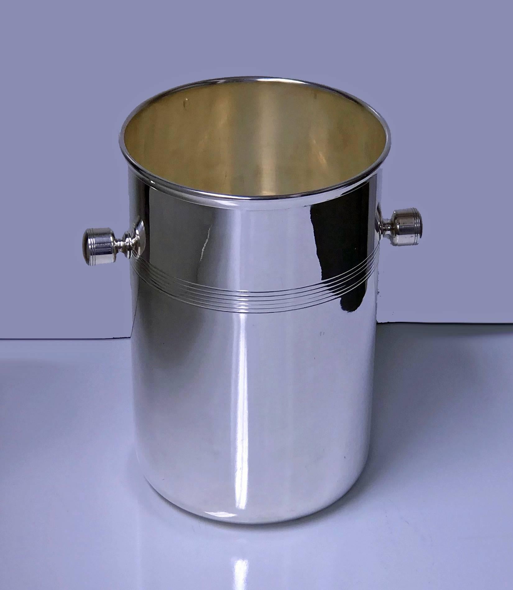 Art Deco French Modernist silver plate wine cooler, circa 1935, by St. Hilaire. The cooler of cylindrical form, plain polished body with groove upper central surround, handles conforming in design. Marks for St Hilaire. Measures: Height: 8.00