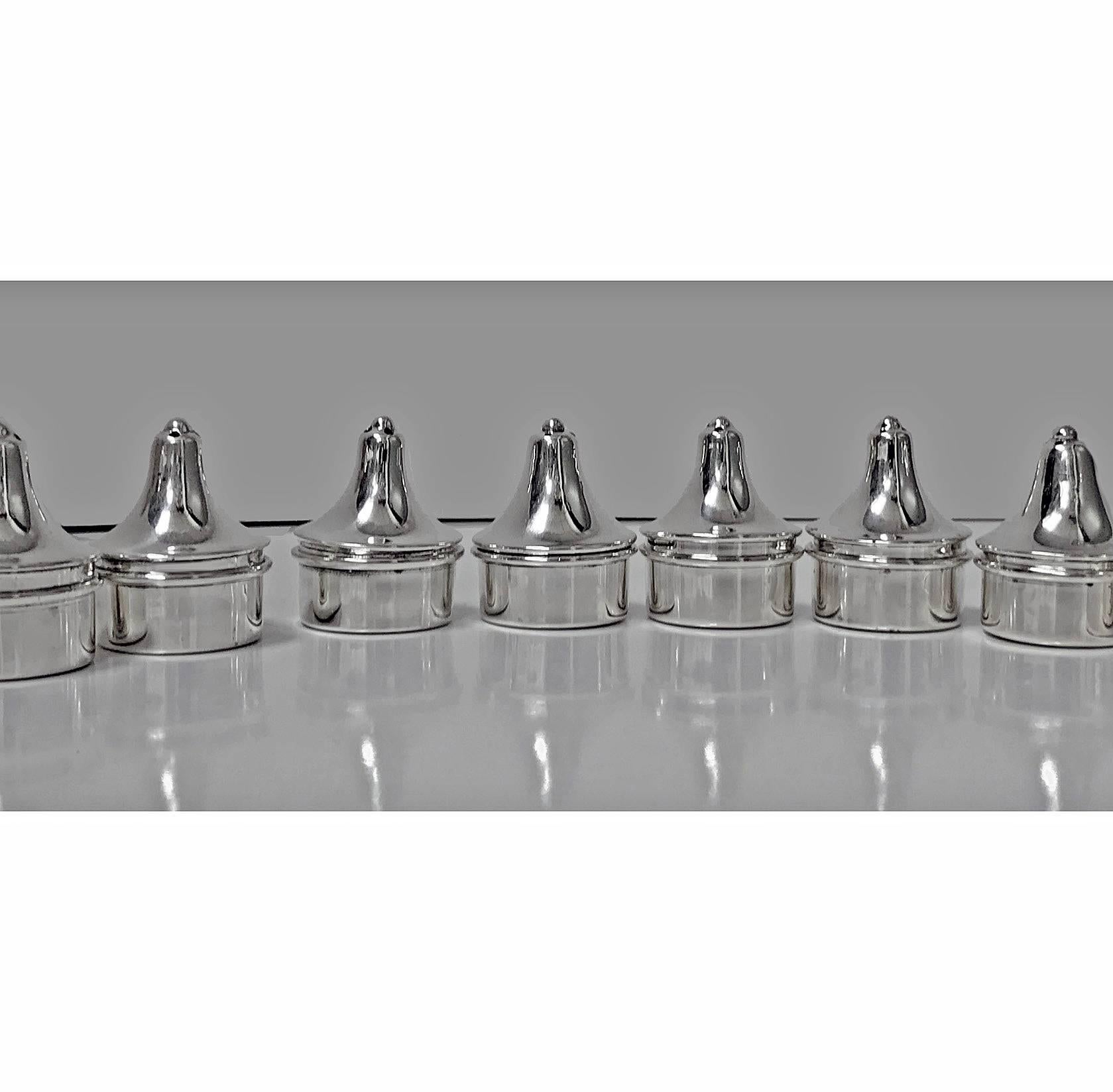 Four pairs of Carl Poul Petersen sterling silver salt and pepper casters, circa 1950. Each of a modernism tower like design. Pierced holes are larger for salt. All stamped with Petersen marks. Measures: Height 1.5 inches. Total item weight: 138.25