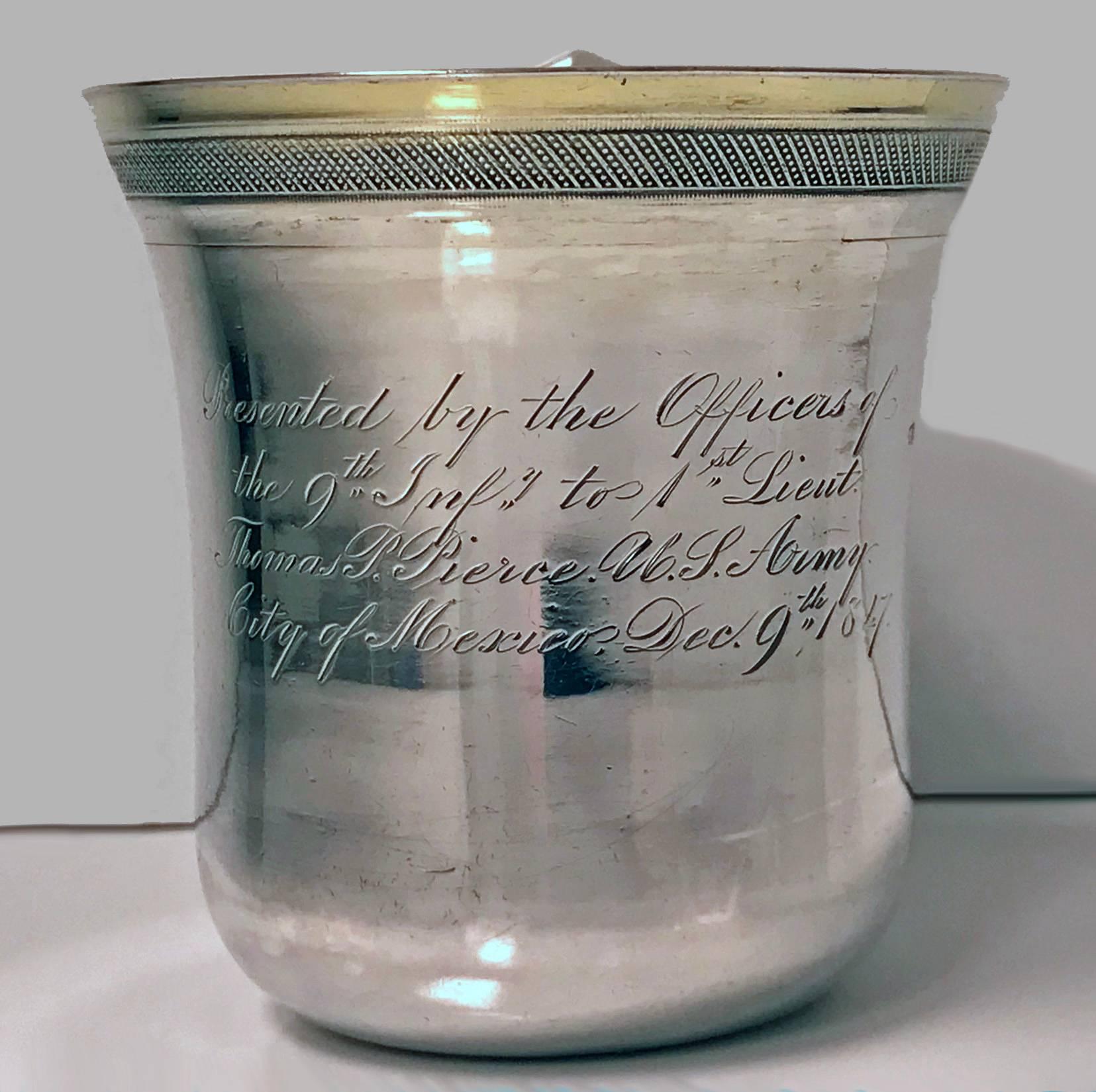 Regimental Spanish Colonial Silver Mexican 19th century Mug, C.1847. Marked  BTON, for the chief assayer Cayetano Buitron, an M with an O over it, for purity, and an eagle tax mark. Of slightly cylindrical form with upper molded everted rim with