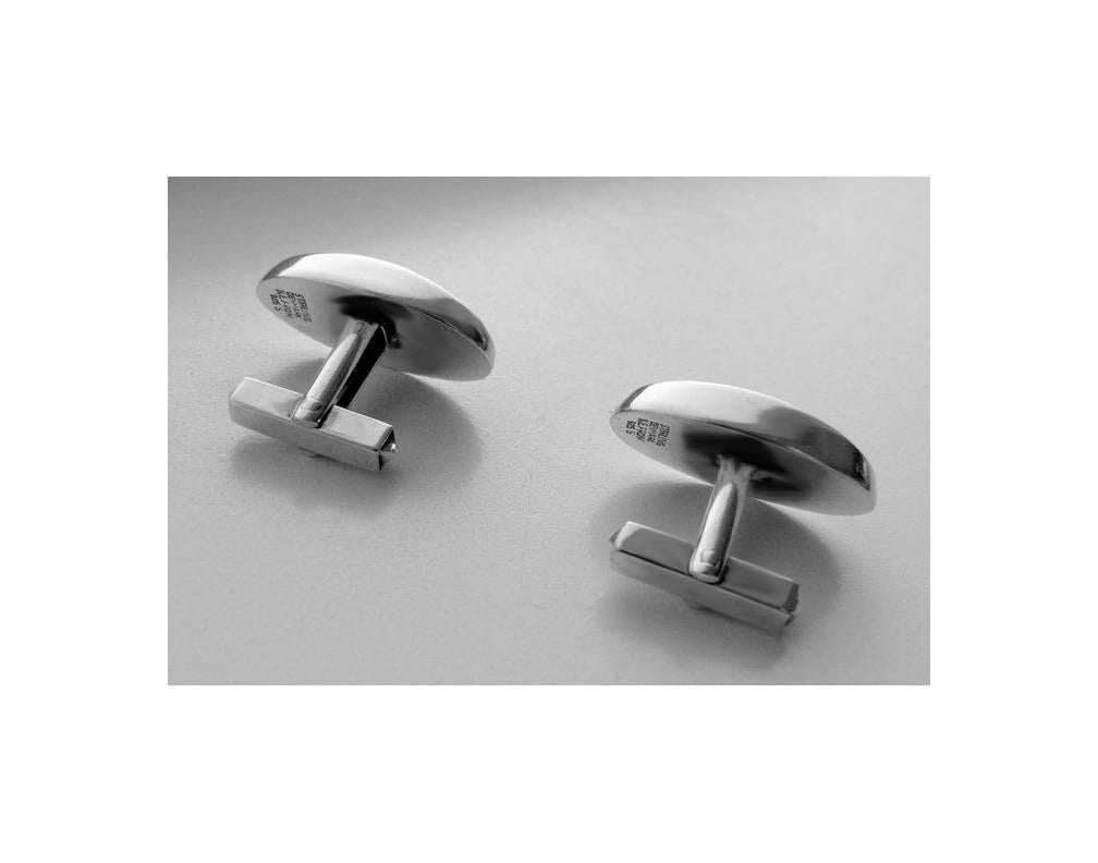 Pair of Danish Sterling Cufflinks, N.E. From, C.1950. The cufflinks of a plain oval striking concave form, `t’ bar fitments. Stamped Sterling Denmark N.E. From 925 S. Measures: 1 x .5 inches. Weight: 11.92 gm