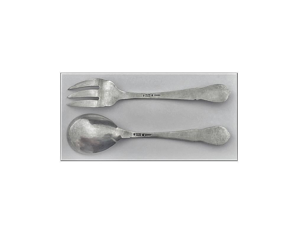 Pair of Carl Poul Petersen hammered Silver Salad Servers, Montreal. C.1930. The Servers, wild berries pattern. Stamped hand made Petersen Sterling marks on reverse. Length: 8.75 inches. Weight: 5.35 oz