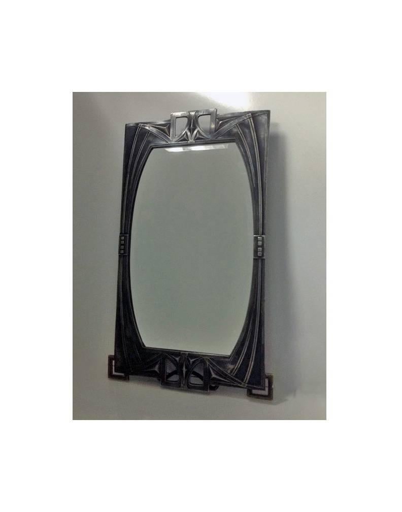 Rare WMF Art Nouveau Jugendstil Secessionist pewter mirror, Germany, circa 1905. All original bevelled glass, back and easel, bracket cornice supports, stylised border with open arts and crafts surmounts. WMF marks and model No 84/38. Measures: