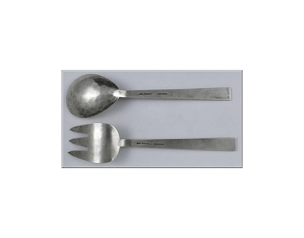 Pair of Modernism Sterling hand made Servers, Adra, American C.1950. Each of plain lightly hammered modernism design, stamped on reverse Adra Sterling Hand Worked. Length: Approximately 9 inches. Weight: 6.20 oz.