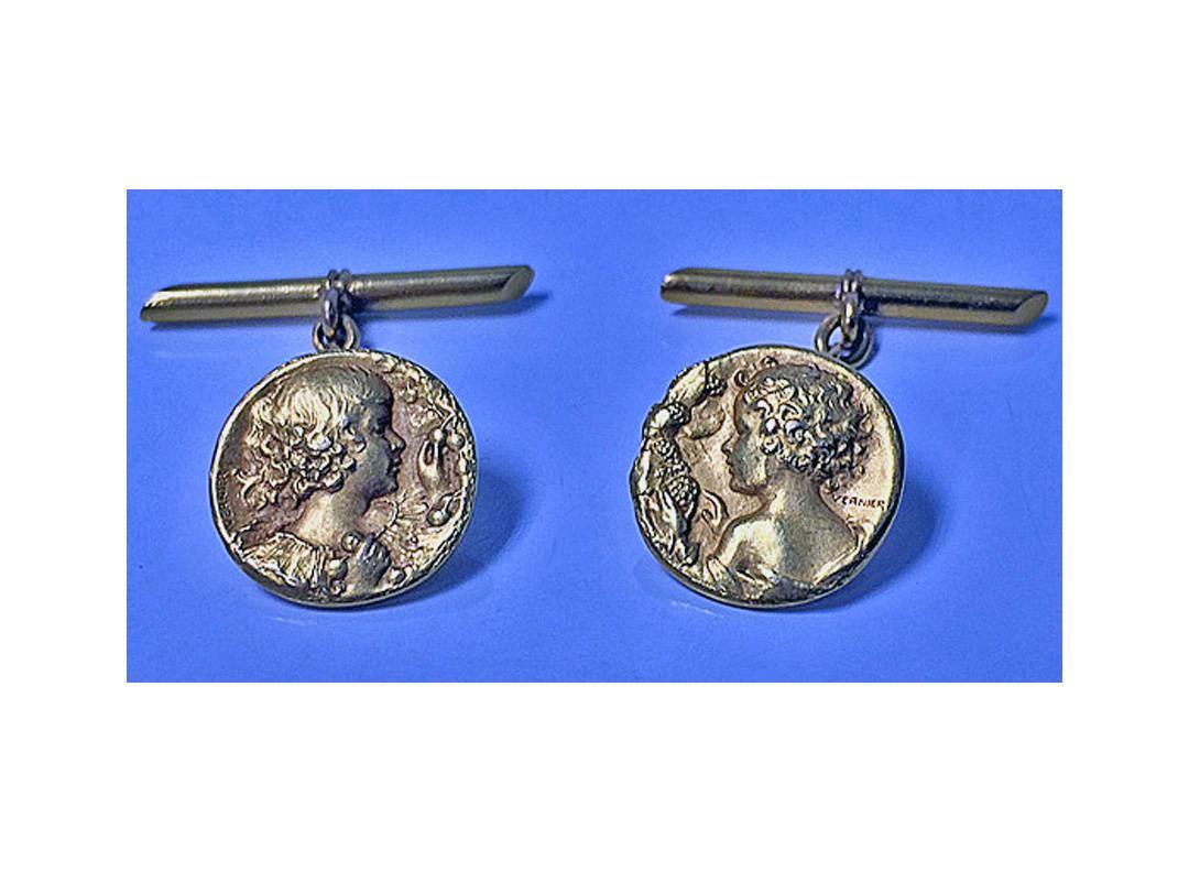 Pair of 22-karat French Art Nouveau cufflinks, Vernier, circa 1890. Each depicting profile of a young maiden facing right and left respectably, cylinder bar fitments, chain link between. Stamped Vernier 22K. Total item weight: 7.75 grams. Length: