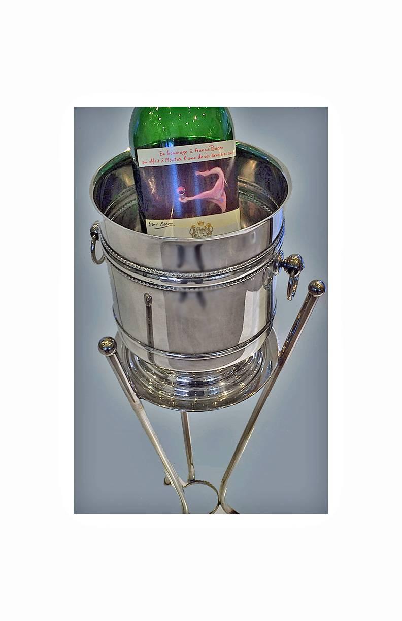 Christofle silver plate cooler, France, circa 1945. The cooler on moulded pedestal base, plain with double upper bead surround, ring loop handles. Marked with Christofle Marks and Christofle France on base. Height: 9 