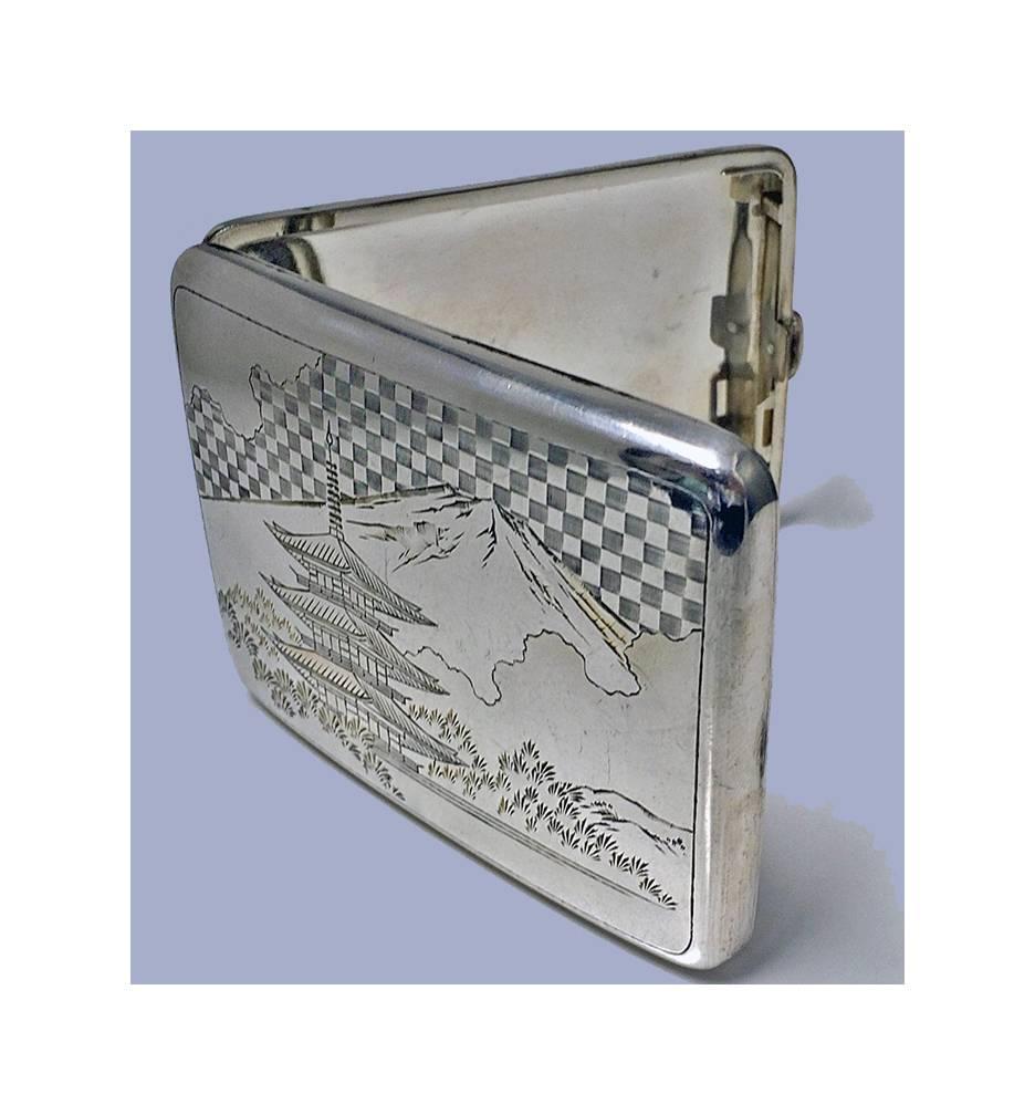 Fine Japanese 950 silver box case, circa 1920. Slightly concave, engraved with scenes of Mount Fuji and Pagoda building with foliage and pine trees, signed with character marks on underside. Measures: 4.25 x 3.00 inches. Weight: 116.04 grams. Minor