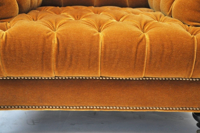 John Boone Olana Tufted Club Chair, with solid maple legs with ebony stain, brass casters and nailheads, upholsted in rich caramel-colored mohair.