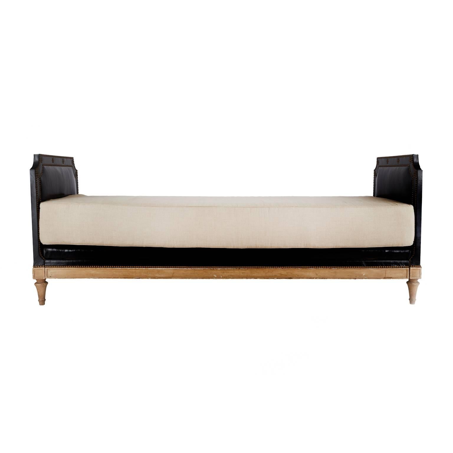 Extremely rare French Maison Jansen (signed) daybed, circa 1930s. Made for the Argentine market during a time when Argentina was extremely wealthy. Newly reupholstered in black Italian leather with brass studded details on a wooden frame. Stamped