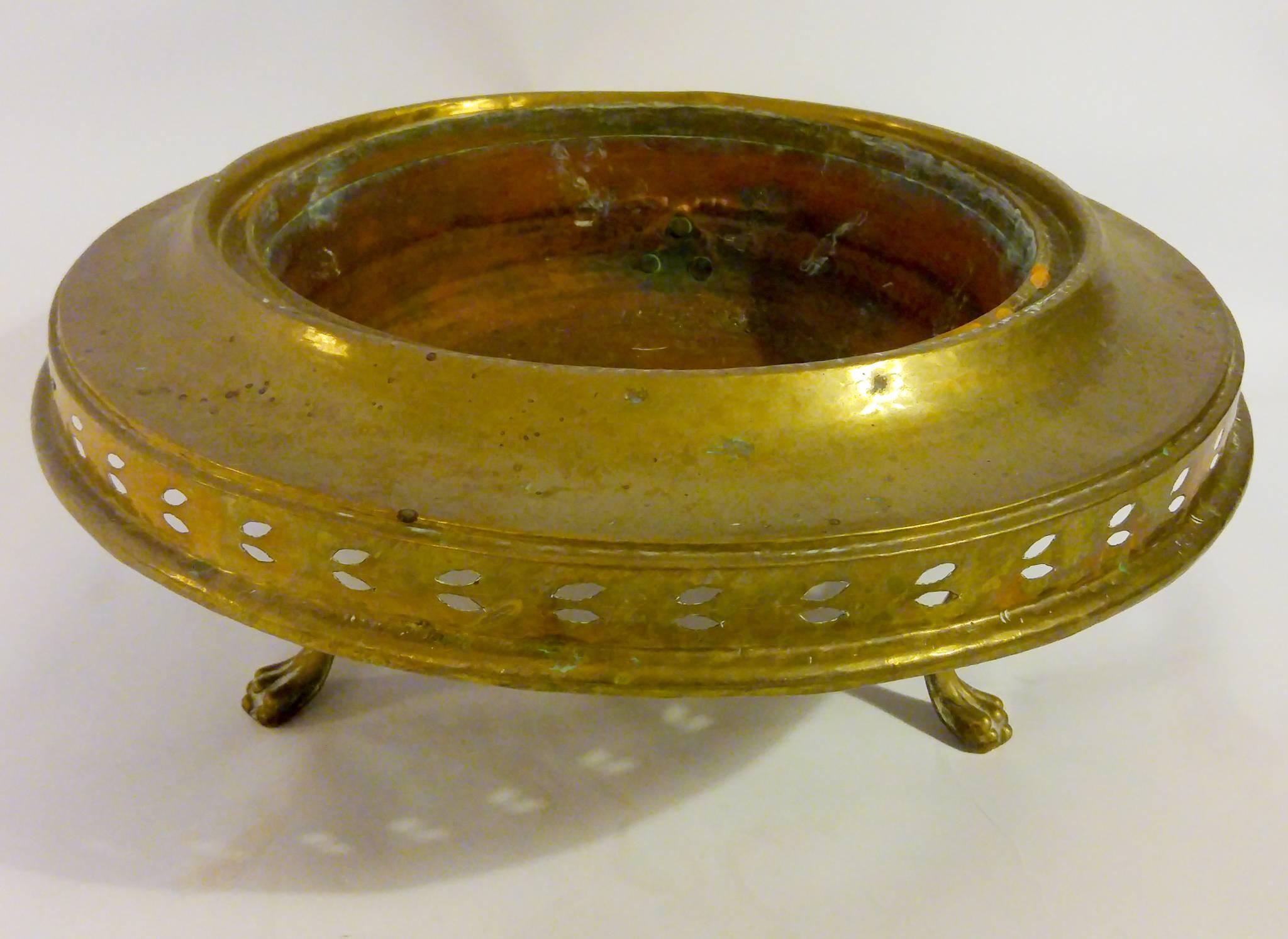 Large size brass Turkish brazier featuring pierced body and female figueral topper. The serpentine feet end in lion's paws. The copper bowl liner used for burning solid fuel, usually charcoal. Braziers principally provide heat, but may also be used