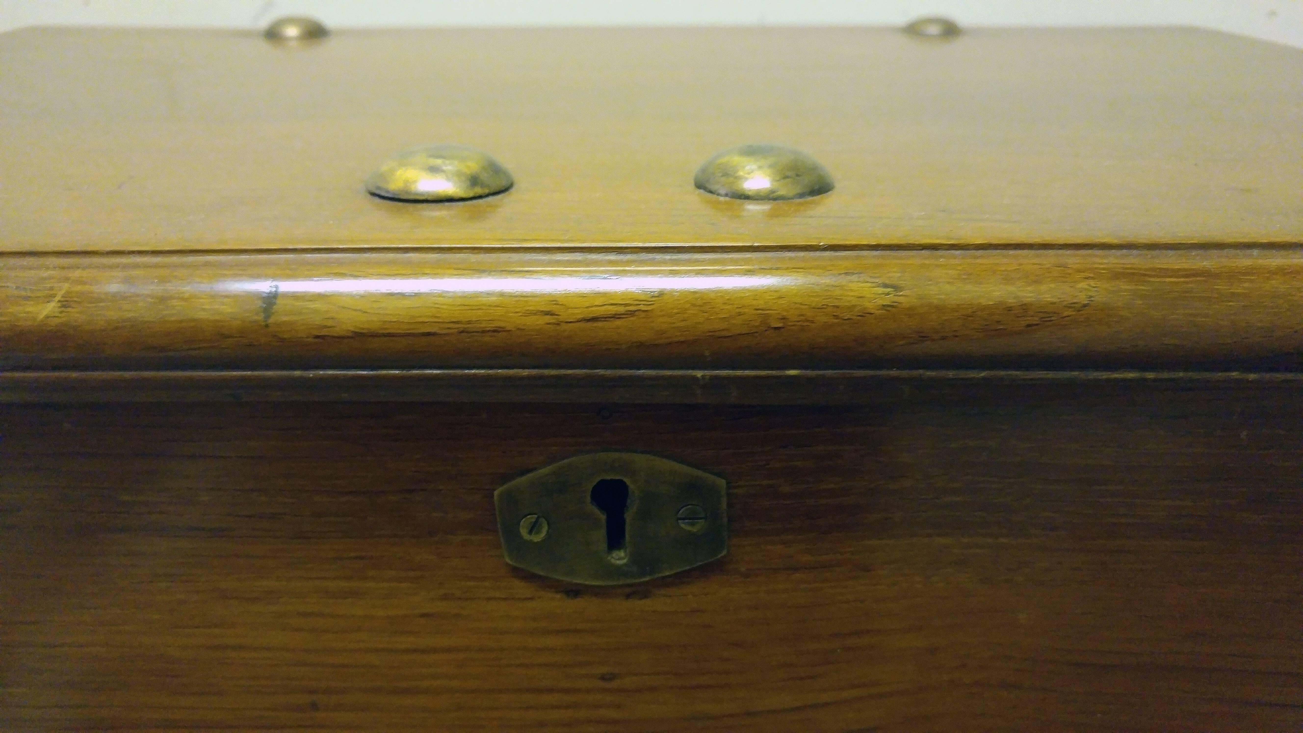 Mid-19th century lap desk or paymaster's box on the original stand constructed of teak. Features include eight compartments and copper fittings.