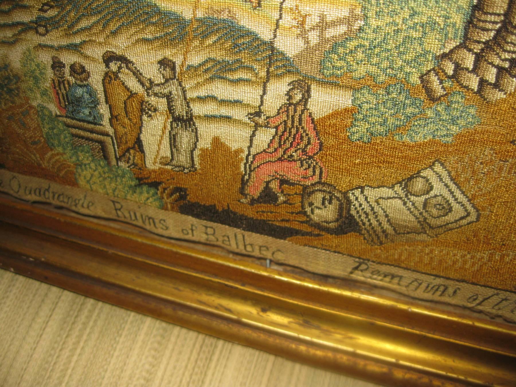 Silk needlepoint embroidery reads along the bottom: 