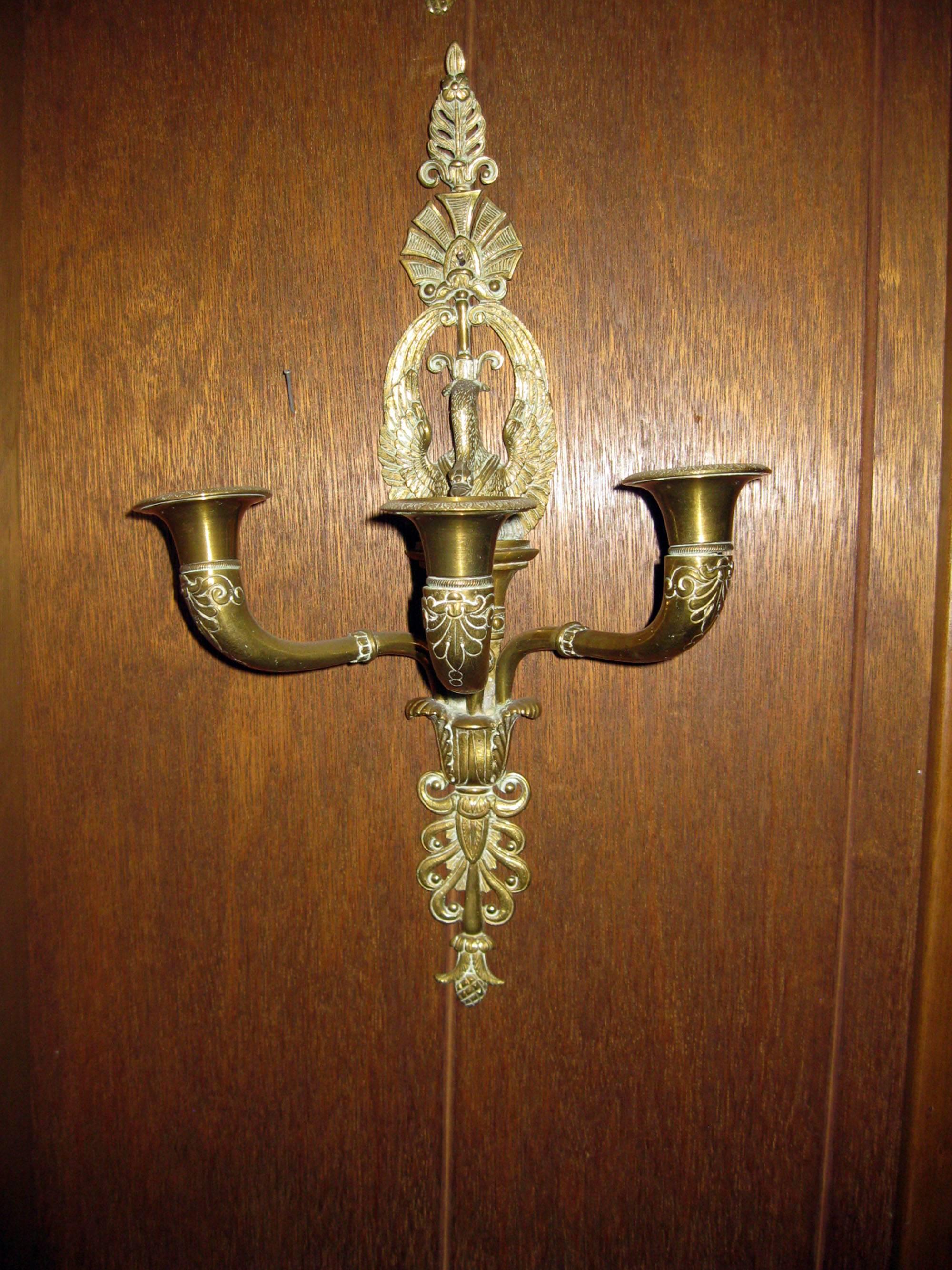 French Empire three light brass sconce pair with swan motif, circa 1820s . Features include incredible detail and great old patina. See measurements below.