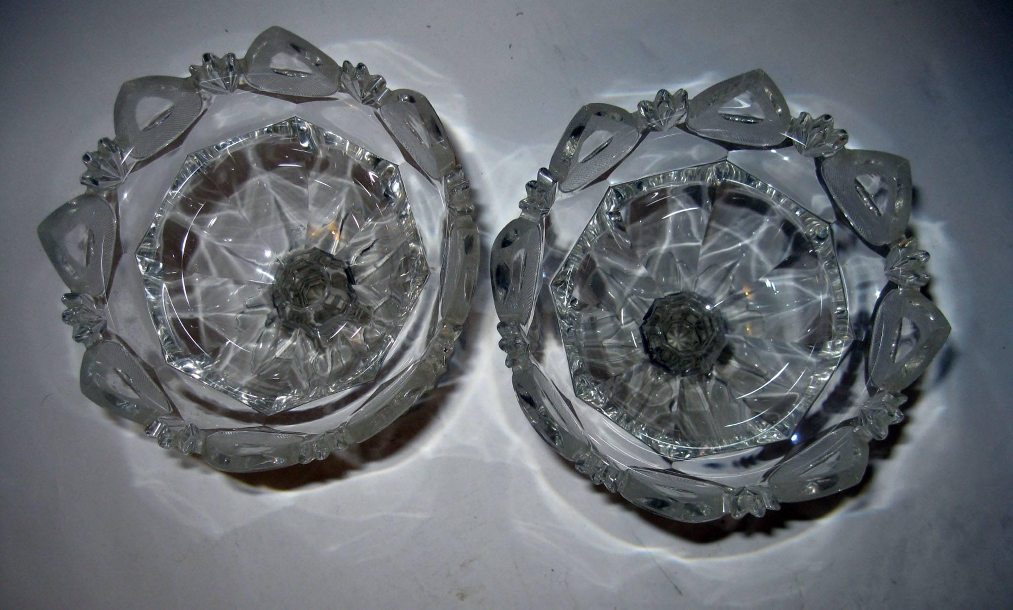 Pair of large English Georgian flint glass compotes or tazzas, featuring graceful pedestals and incredible detail with a saw tooth edge.
Measure: 7.25 inches at top and 5.50 inches across pedestal bottom. See other measurements below.

