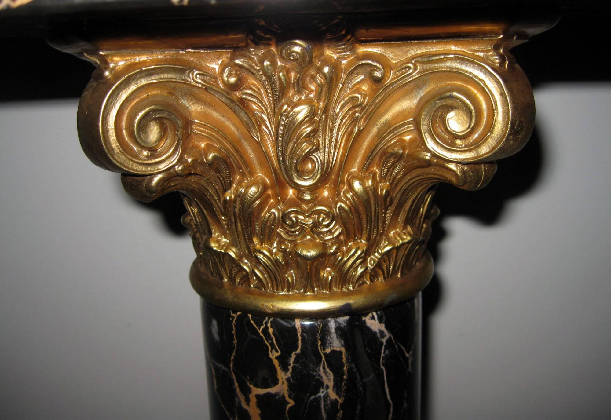 Neoclassic pedestal featuring gorgeous black marble with slight pink and white vein.
Bronze doré Corinthian column support with same band at base.
See measurements below.