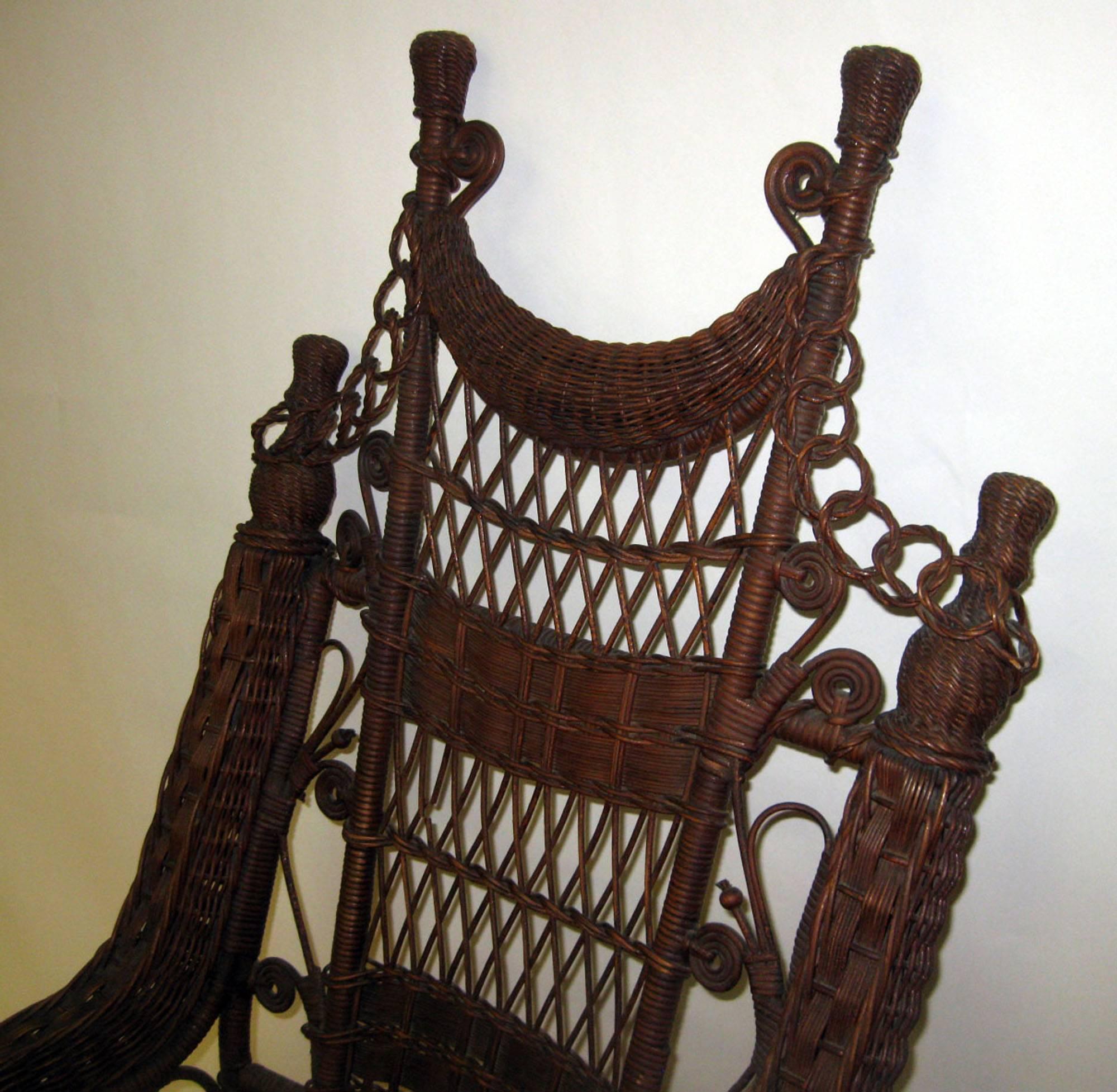 Although unlabeled, this is a high quality design and typical of those made by the firm of Heywood Brothers & Company. This company tended to design wicker pieces of a more airy and detailed style than its chief competitor, the Wakefield Rattan