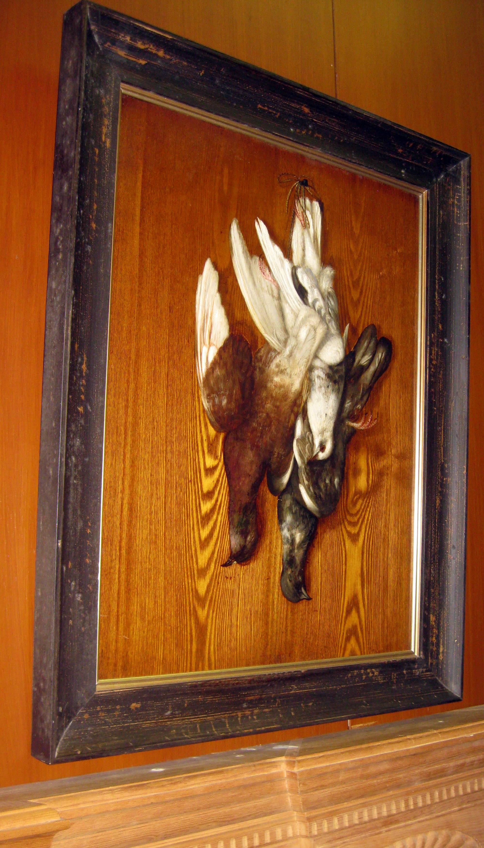 In the style of George Cope, this Classic Trompe l'oeil oil on wood panel depicts a hunt scene of three doves and features much detail and subtle rich color. It is newly framed in a rustic wooden frame.
See measurements above.
