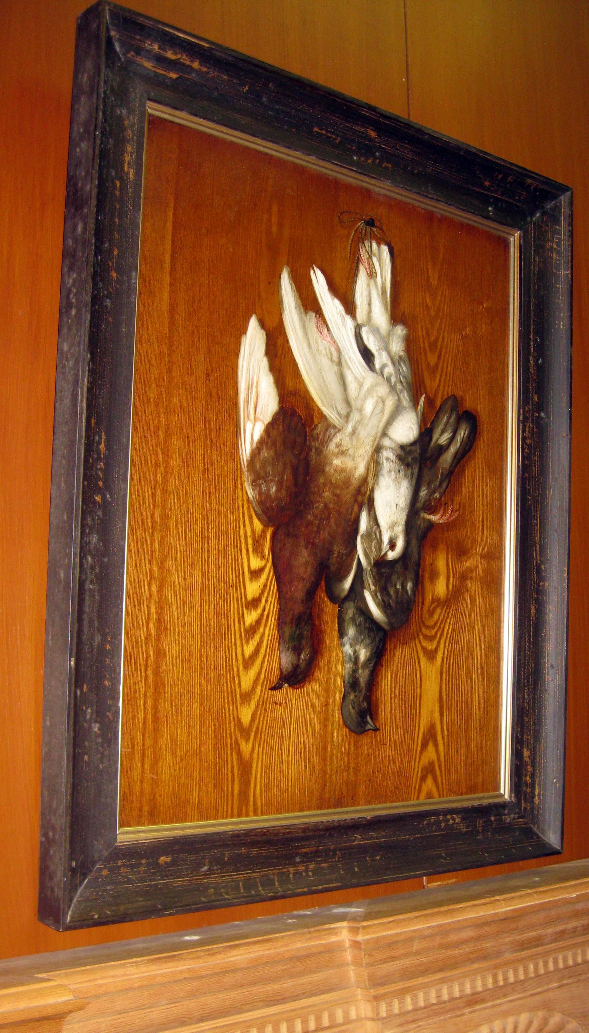 In the style of George Cope, this Classic Trompe l'oeil oil on wood panel depicts a hunt scene of three doves and features much detail and subtle rich color. It is newly framed in a rustic wooden frame.
See measurements below.