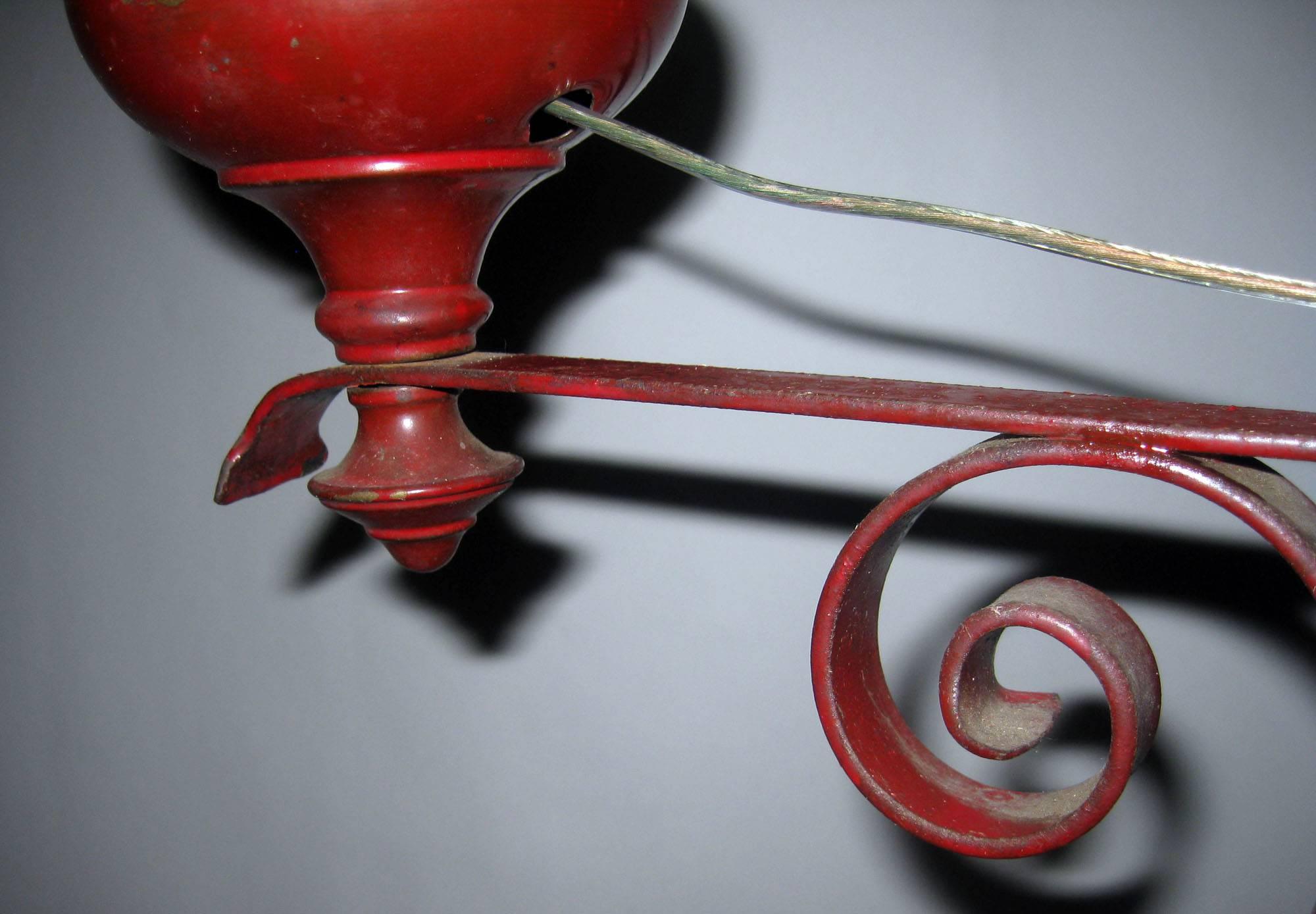 Rare painted iron standing floor lamp made to burn oil but converted to electricity. Nice lines and detail with upturned feet, scroll work and finial at top. See measurements below.