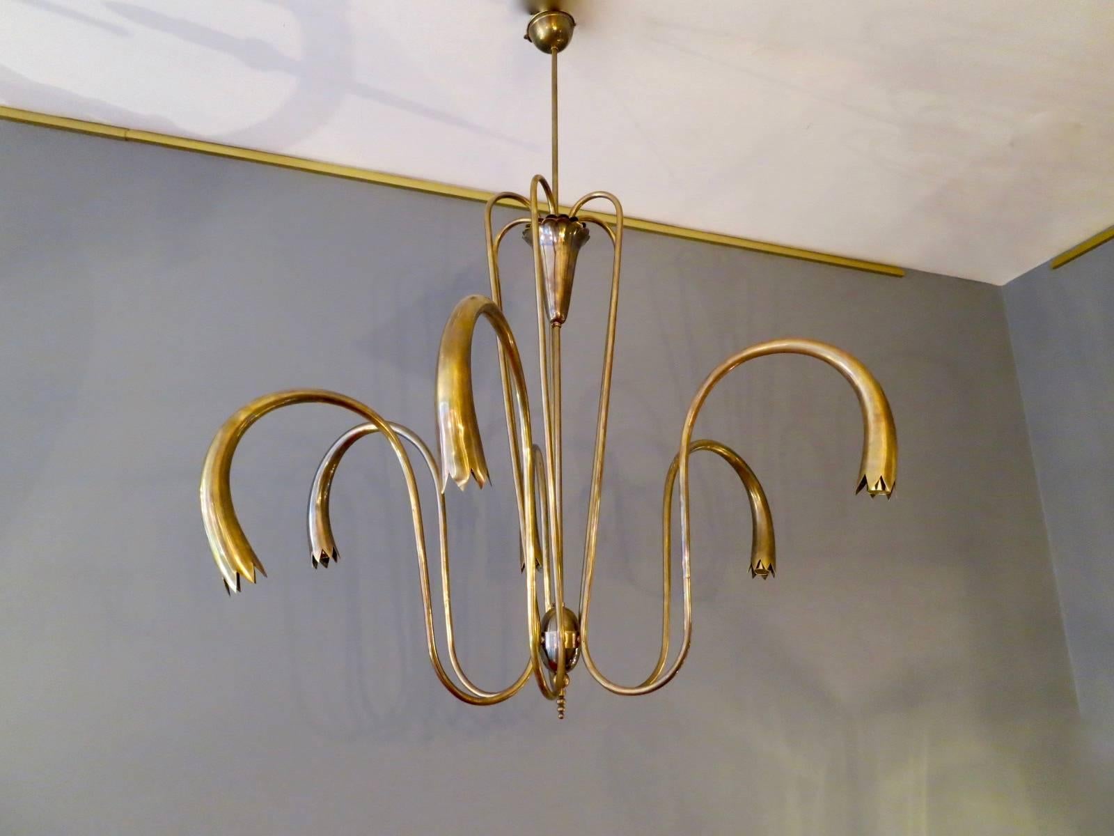A much stylised Italian chandelier from the 1950s or possibly earlier with six trumpet shaped arms. Attributed to Arredoluce.