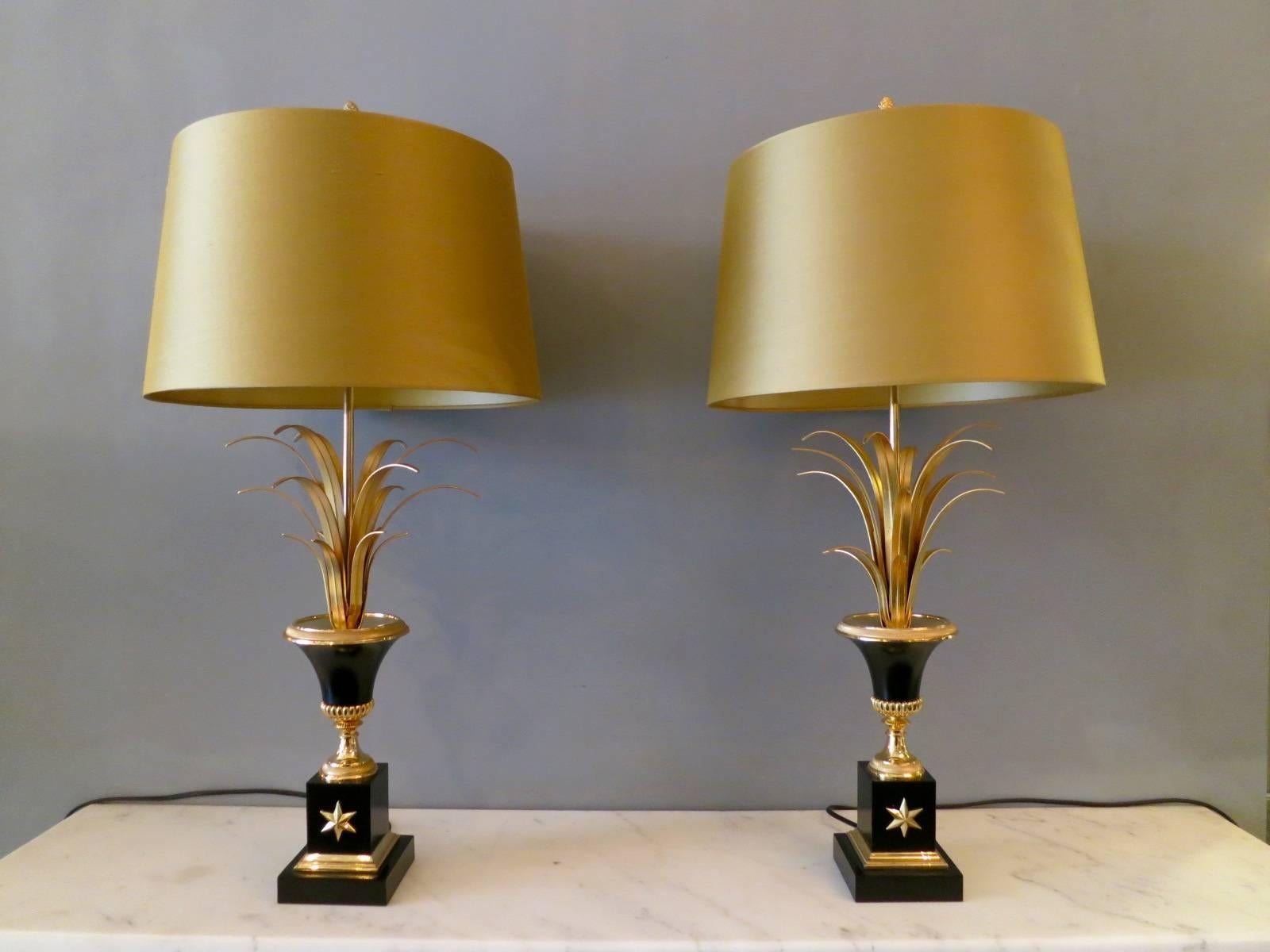 A pair of brass and black lacquer lamps with new handmade silk shades. In the manner of Maison Charles.

Measures: 73cm high x 35cm wide.