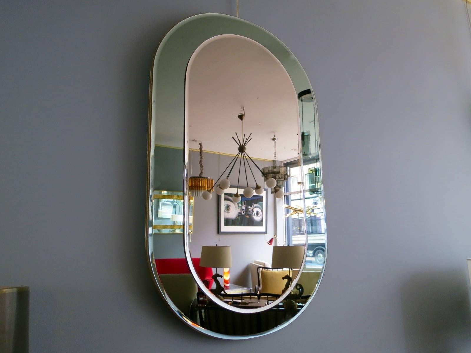 An Italian green glass beveled bordered mirror, with bronze tint beveled mirror panel. Can be hung portrait or landscape,

circa 1950s.

Measures: 115 cm x 72 cm.