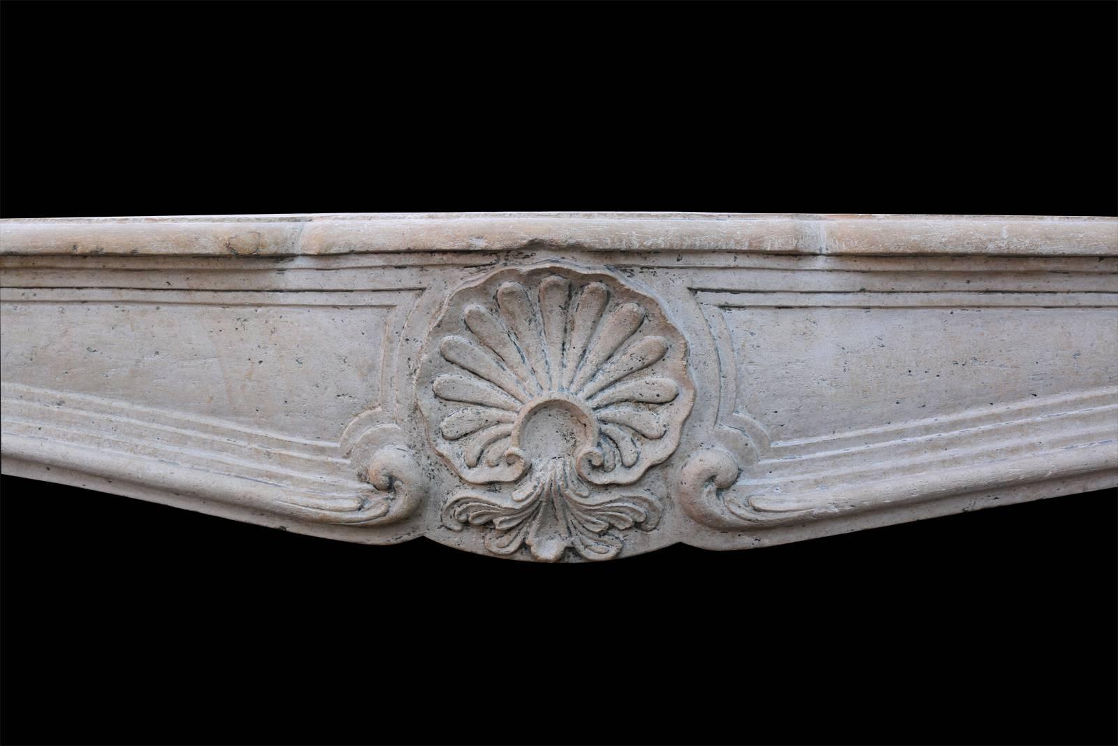 Carved 19th Century French Limestone Louis XV Style Fireplace Mantel