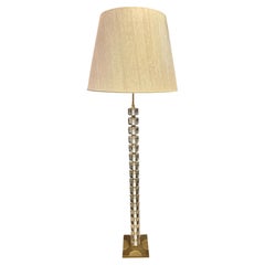 A brass and Lucite floor lamp