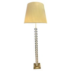 A brass and Lucite floor lamp