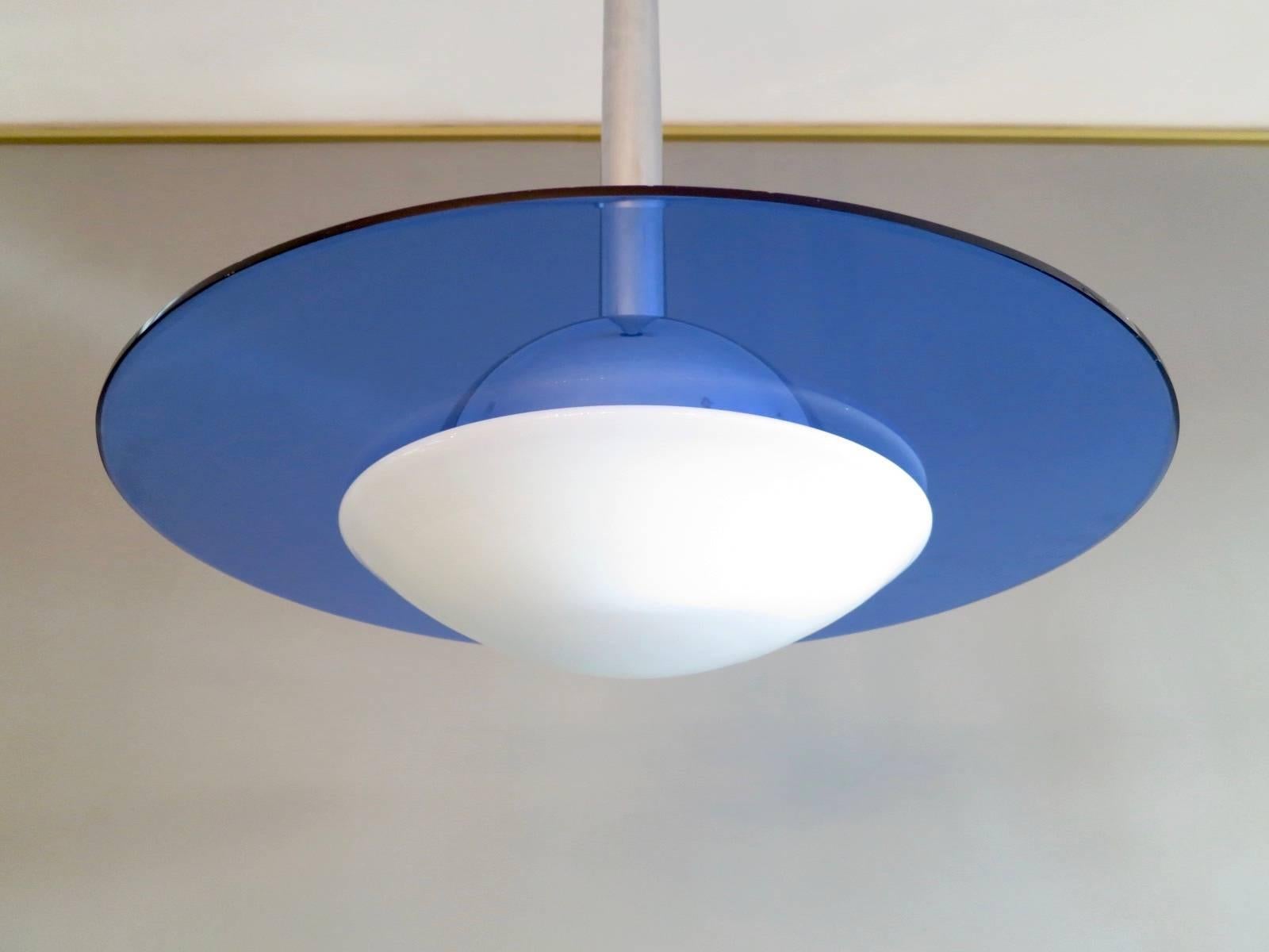 A Mid-Century pendant in chrome with blue glass and opaque glass diffusers. The chrome stem extending to give extra drop. A good quality piece in fantastic condition. 

Measures: Standard drop 93cm, extended 130cm.