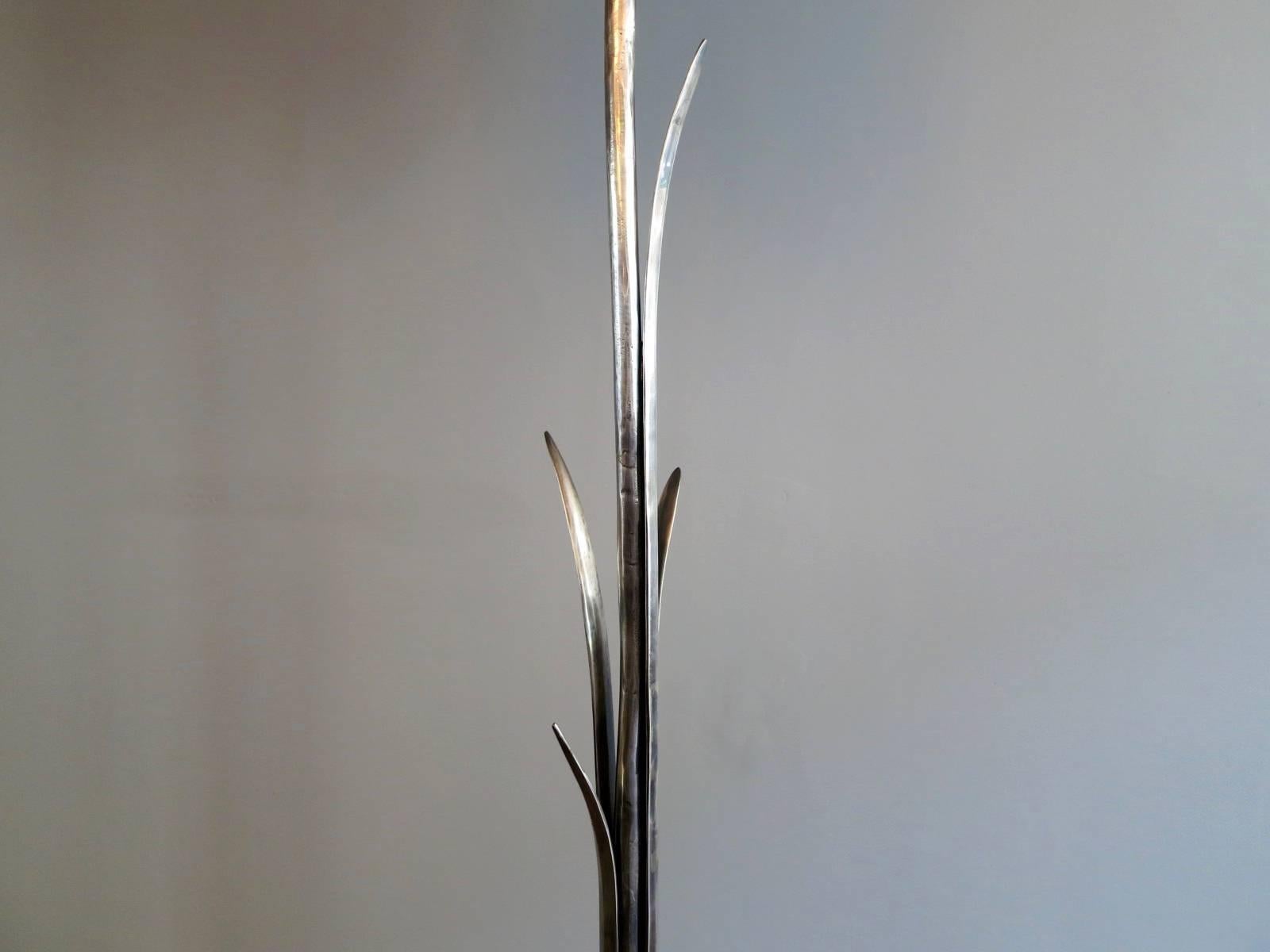 A nickel-plated bronze palm floor lamp by Valenti Madrid. Signed.