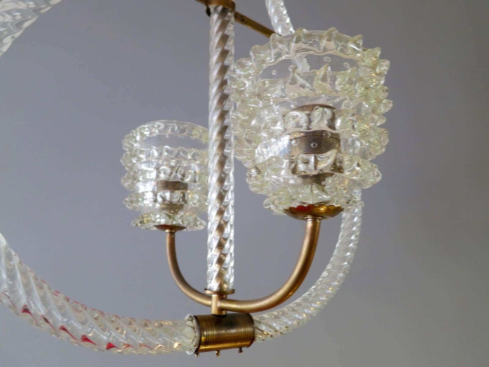 An early 20th century pendant by Barovier & Toso. Delicate rope twisted glass with brass fittings and cut-glass light shades and ceiling rose. The light fittings swing out to desired position. Re wired.