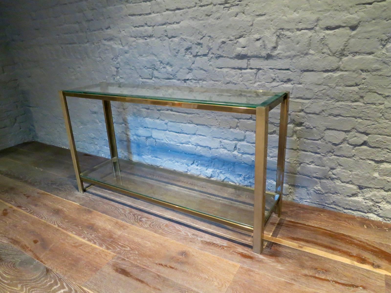 A quality console table with two bevelled glass tops and patinated brass frame, French circa late 20th century.
