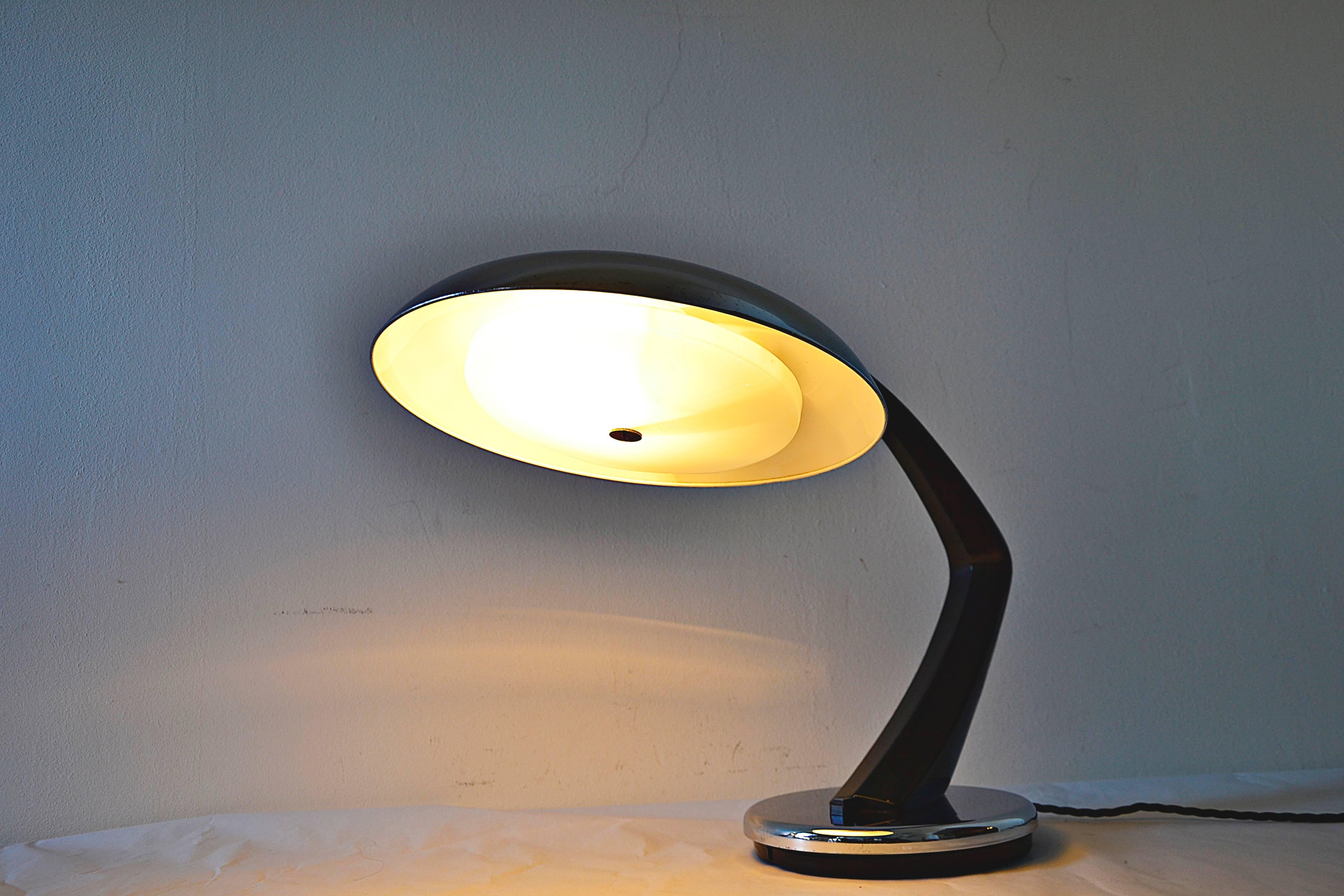 A beautiful black and chrome boomerang table lamp, executed in the 1960s by Fase, Madrid. 
In very good condition. 