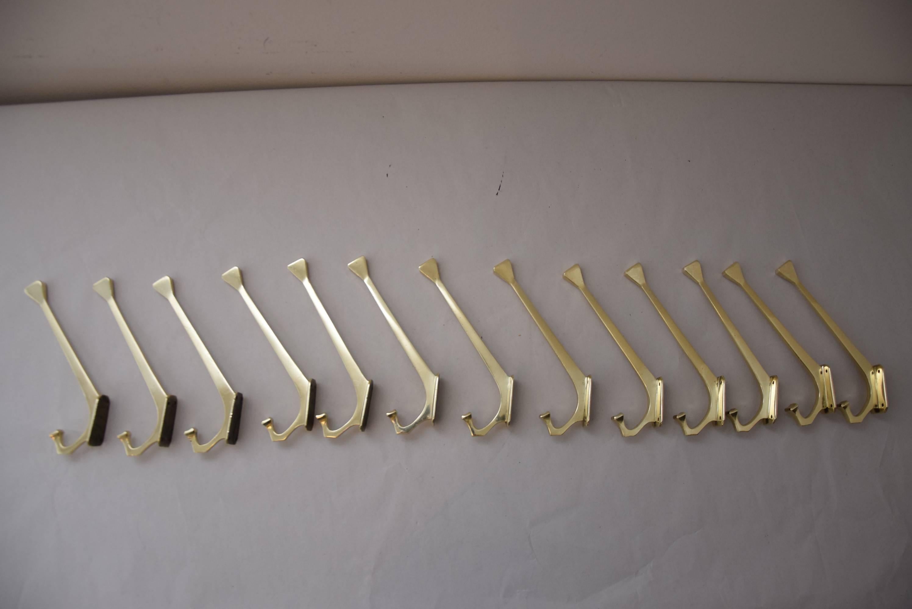 13 jugendstil wall hooks. 
Polished and stove enameled.
priced and sold per piece.

