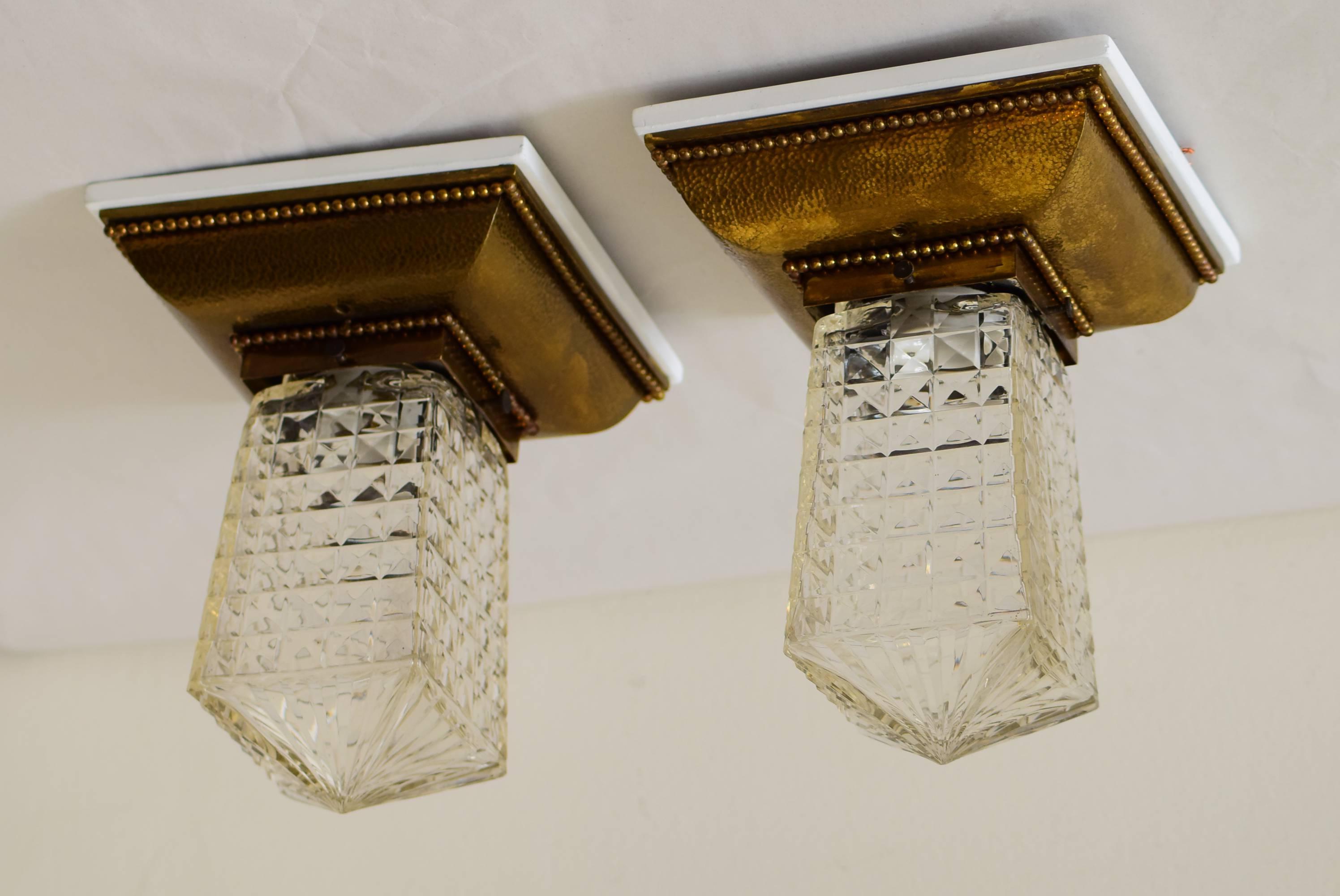 Two hammered ceiling lamp with cut glass.
Original condition.
Very nice original patina,
solid brass.
Wood painted white.