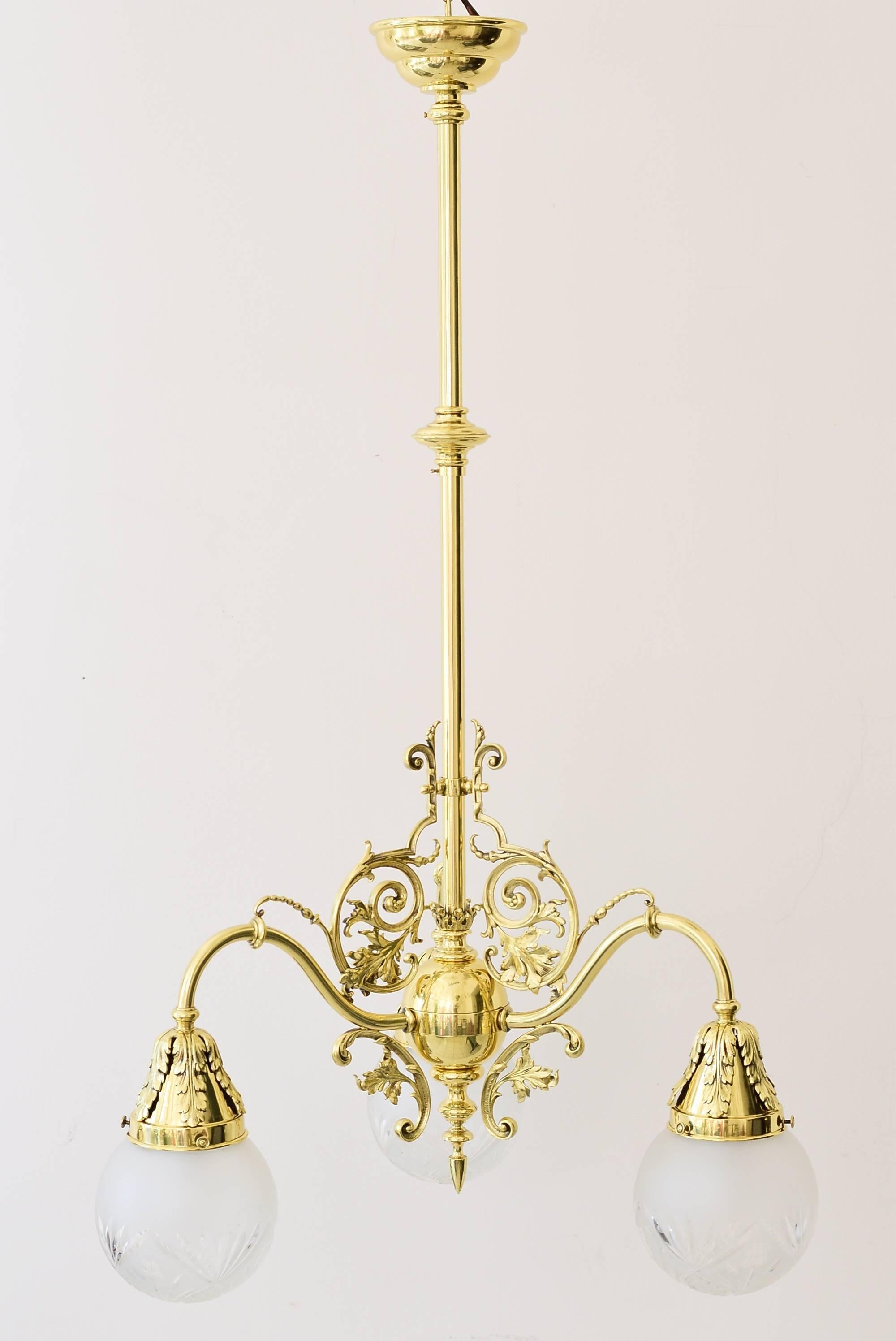 Late 19th century Historistic ceiling lamp with original glass shades
polished and stove enameled.