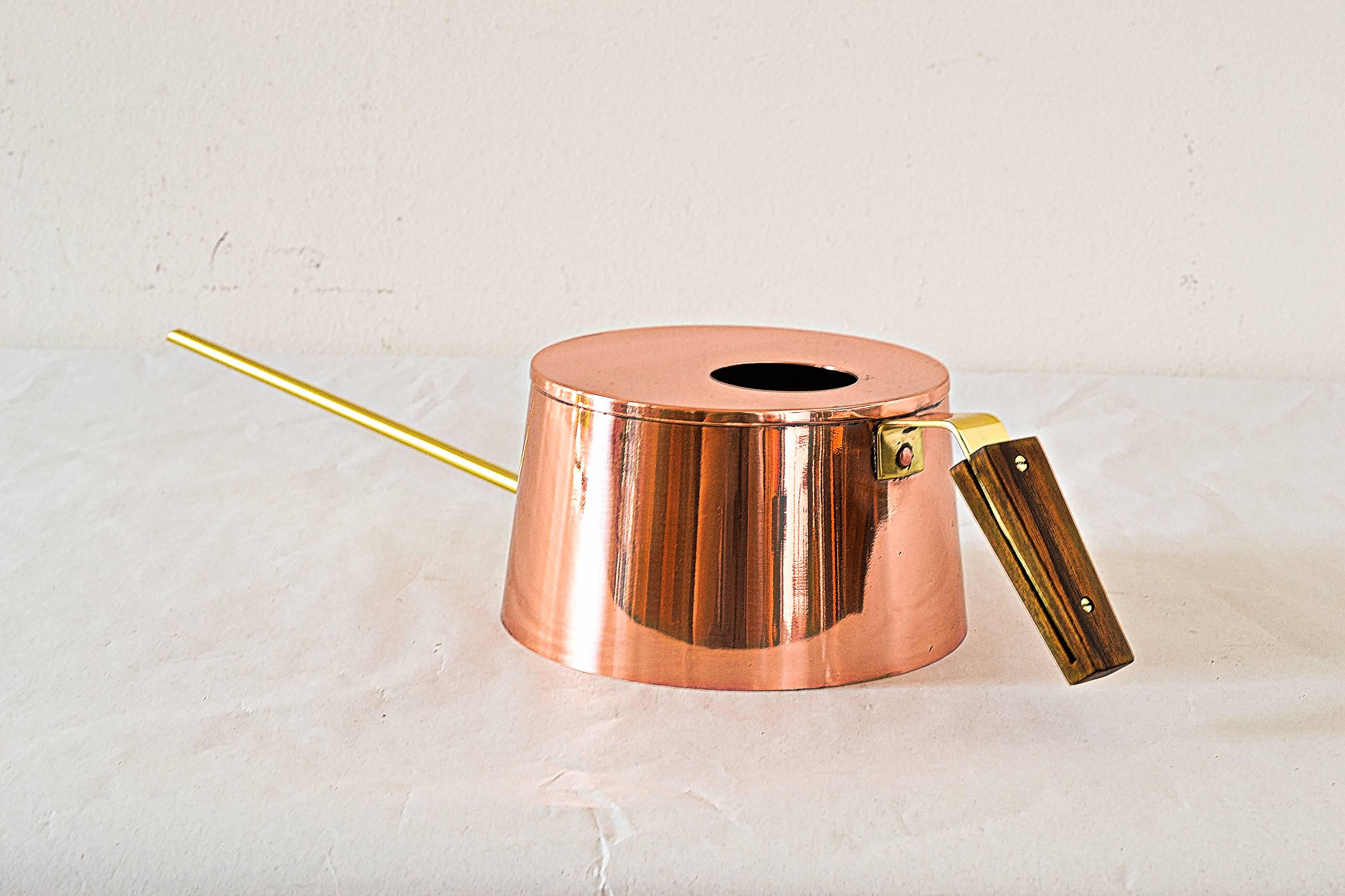 Watering can 
Polished and stove enameled.
Copper and brass.