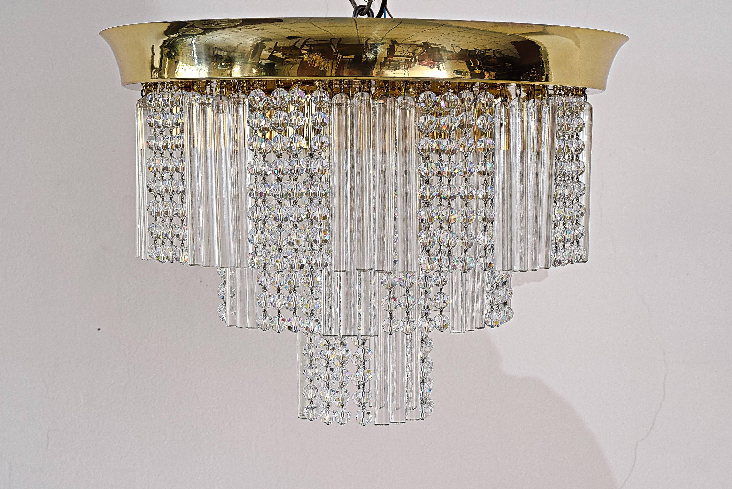 Huge Kalmar three-tier glass flush mount with crystals.
Polished and stove enameled.
The chandelier is lighted with nine bulbs.
3 are available, priced and sold per piece.

