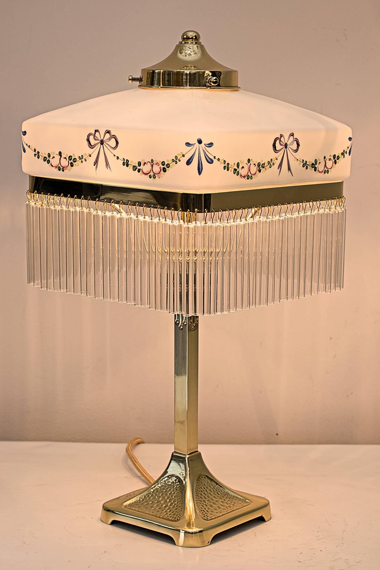 Jugendstil table lamp with beautiful hand-painted opal glass shade glass sticks are replaced (new glass sticks) polished and stove enamelled.