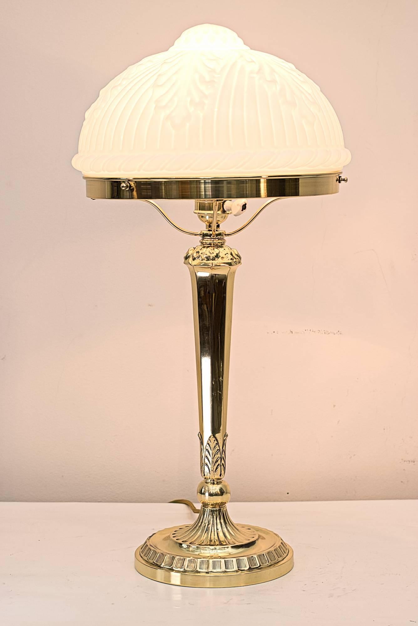 Historistic table lamp with original glass shade 
polished and stove enamelled.