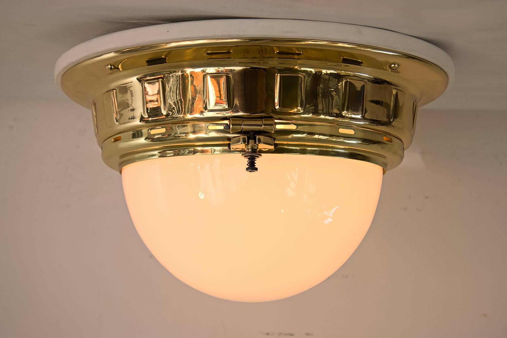 Otto Wagner tramway lamp 
polished and stove enamelled
two bulbs
White wood plate replaced.