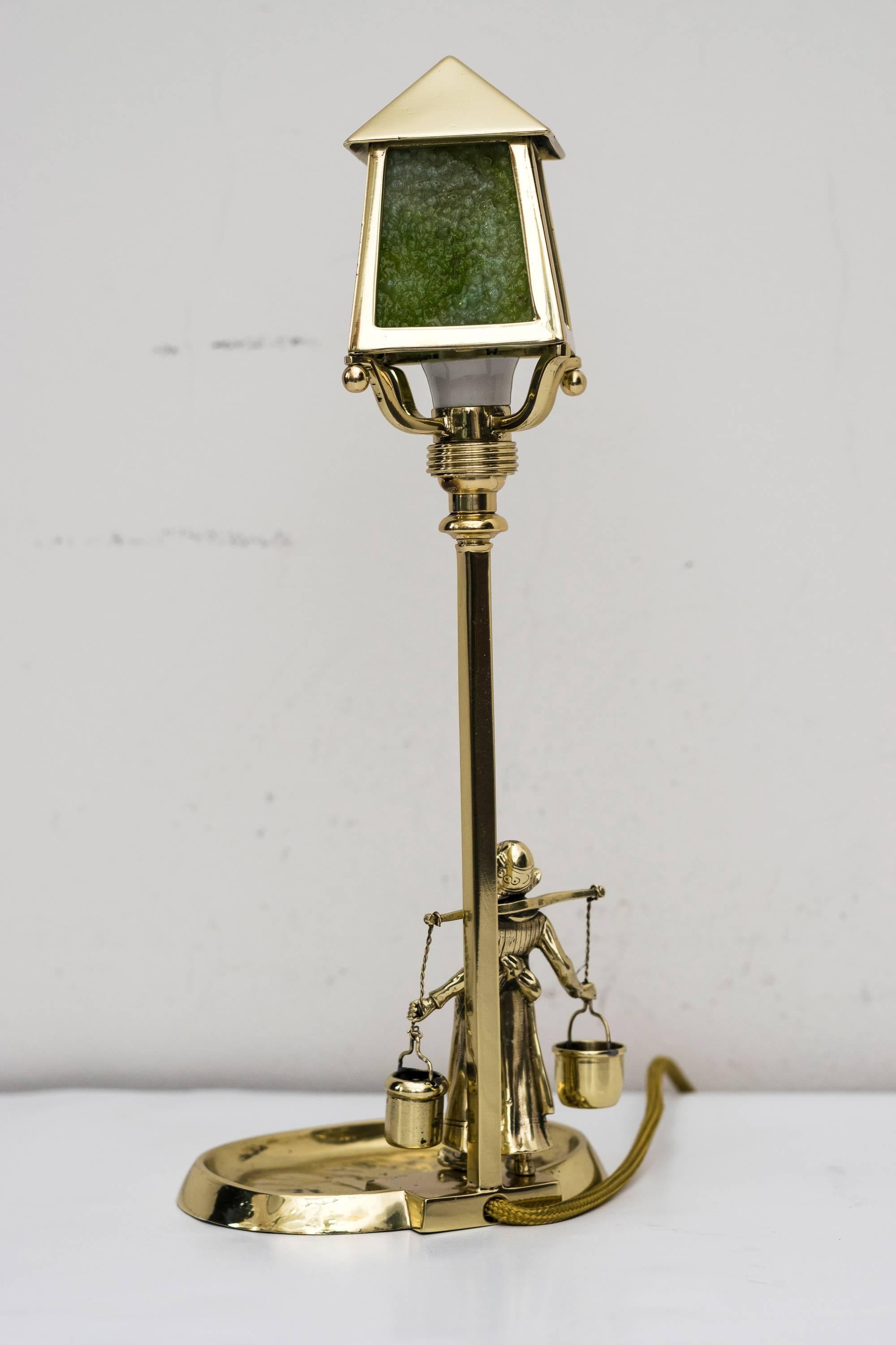 Jugendstil table lamp with green opaline glass
polished and stove enamelled.