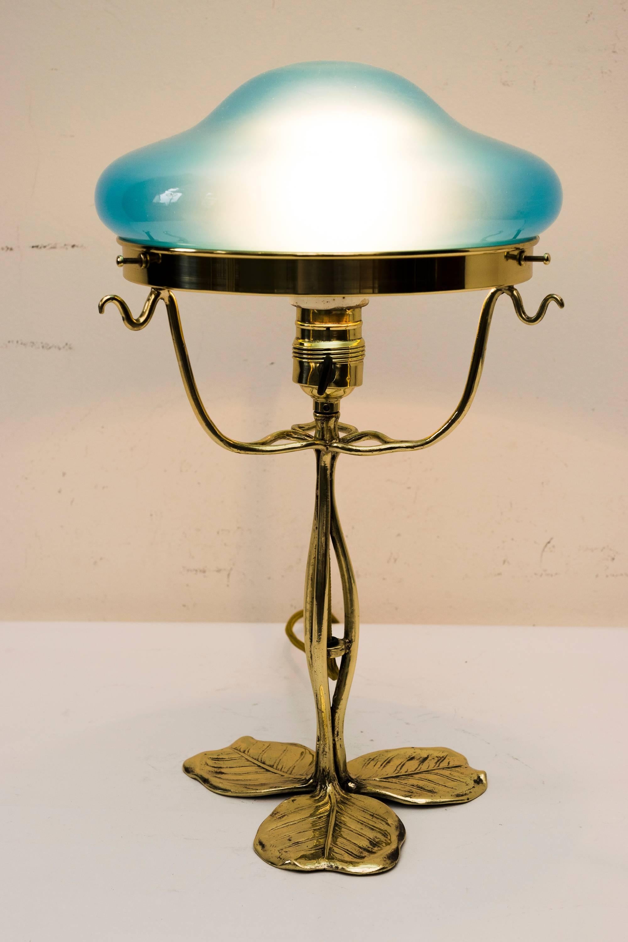 Jugendstil floral table lamp with opaline glass shade
polished and stove enamelled.