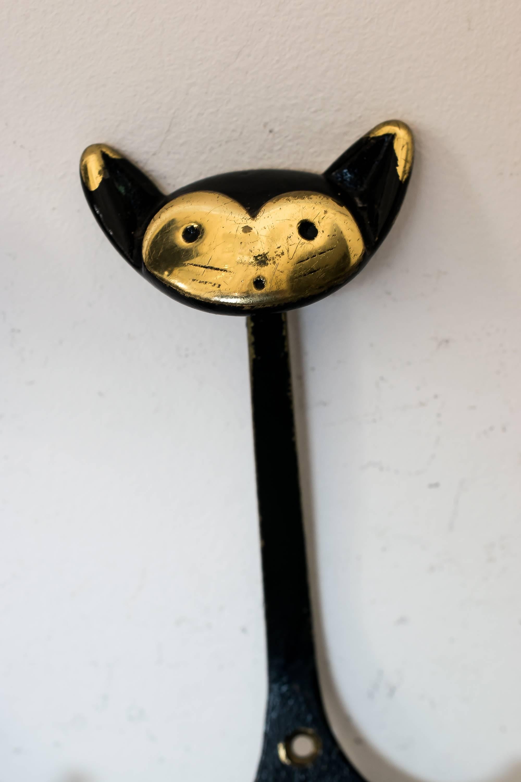 Blackened Two Walter Bosse Wall Hooks Shows a Cat and a Lion, circa 1950s
