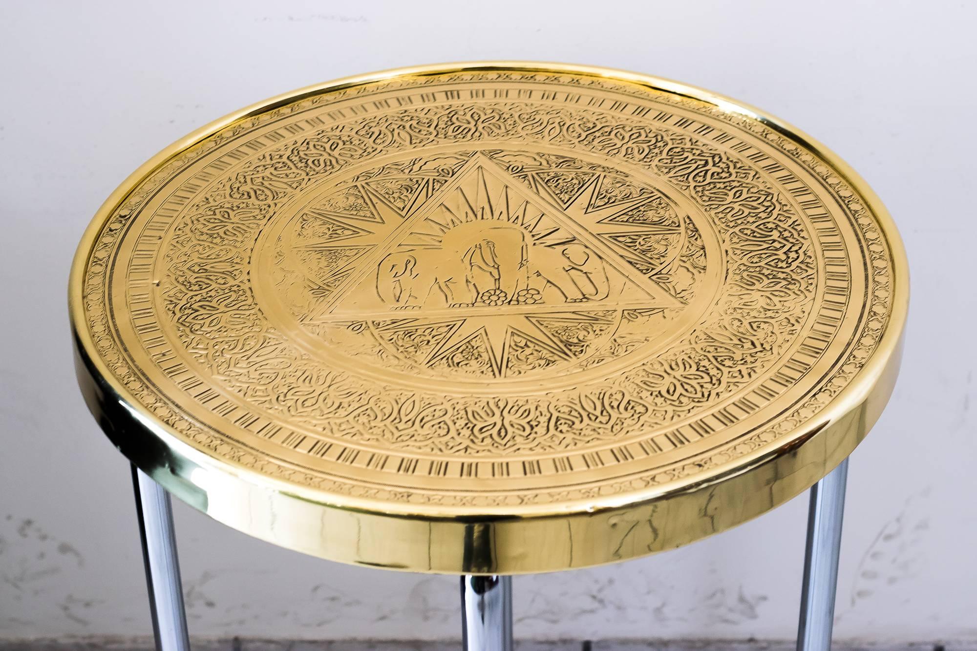 Decorative Art Deco table circa 1930 with elephants
Steel pipe nickel-plated
Brass polished and stove enameled.