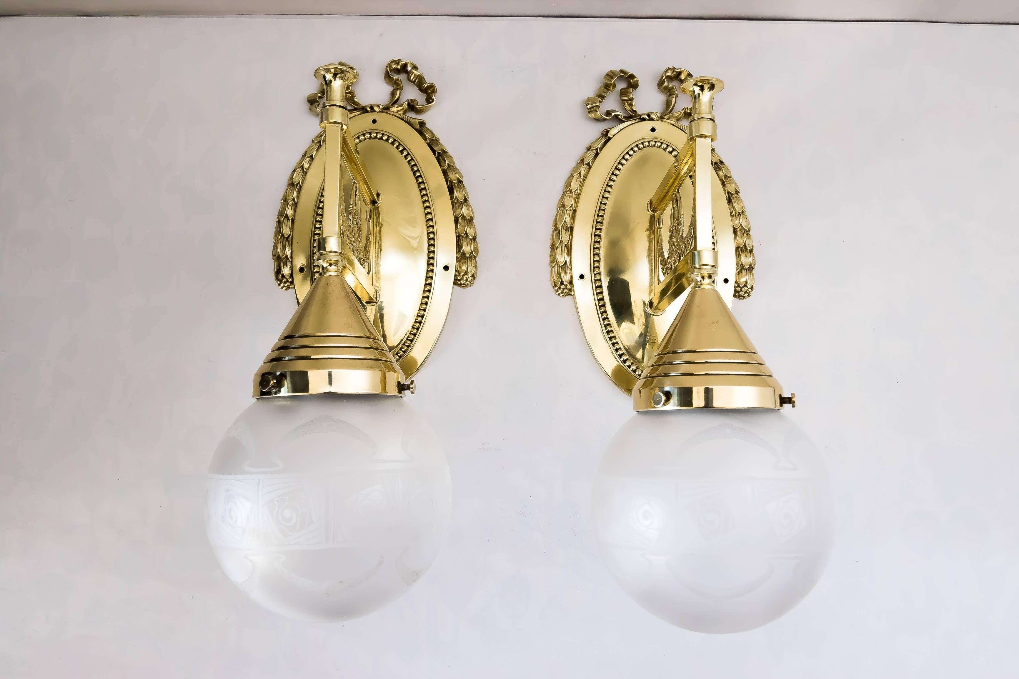 Two beautiful Jugendstil wall lamps with original glass
polished and stove enameled.