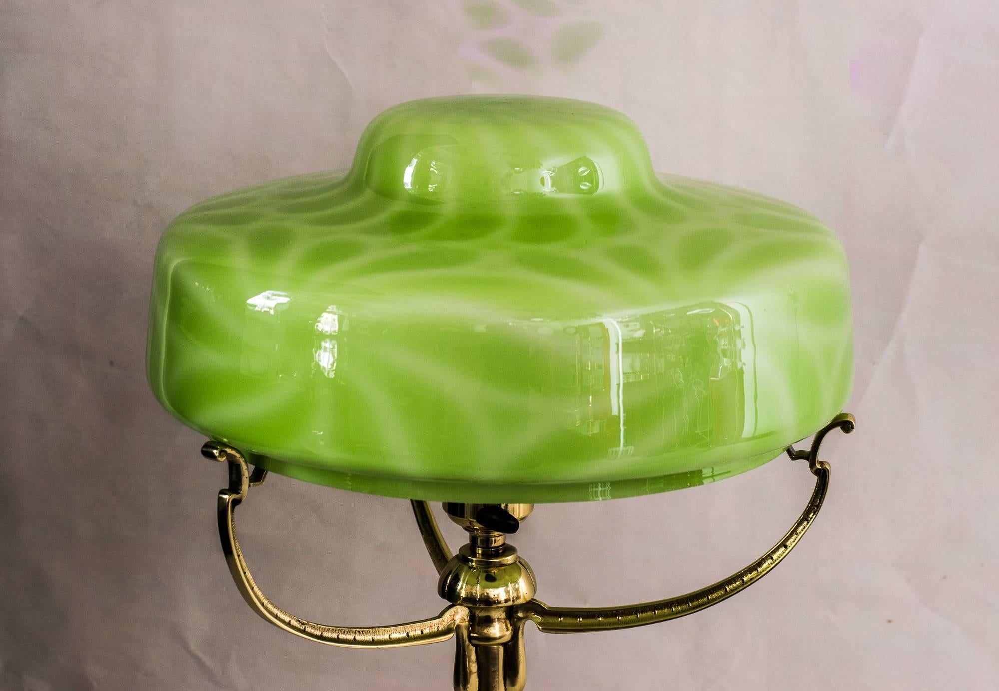 Beautiful Art Nouveau table lamp with original opaline glass shade, circa 1907s
polished and stove enamelled.